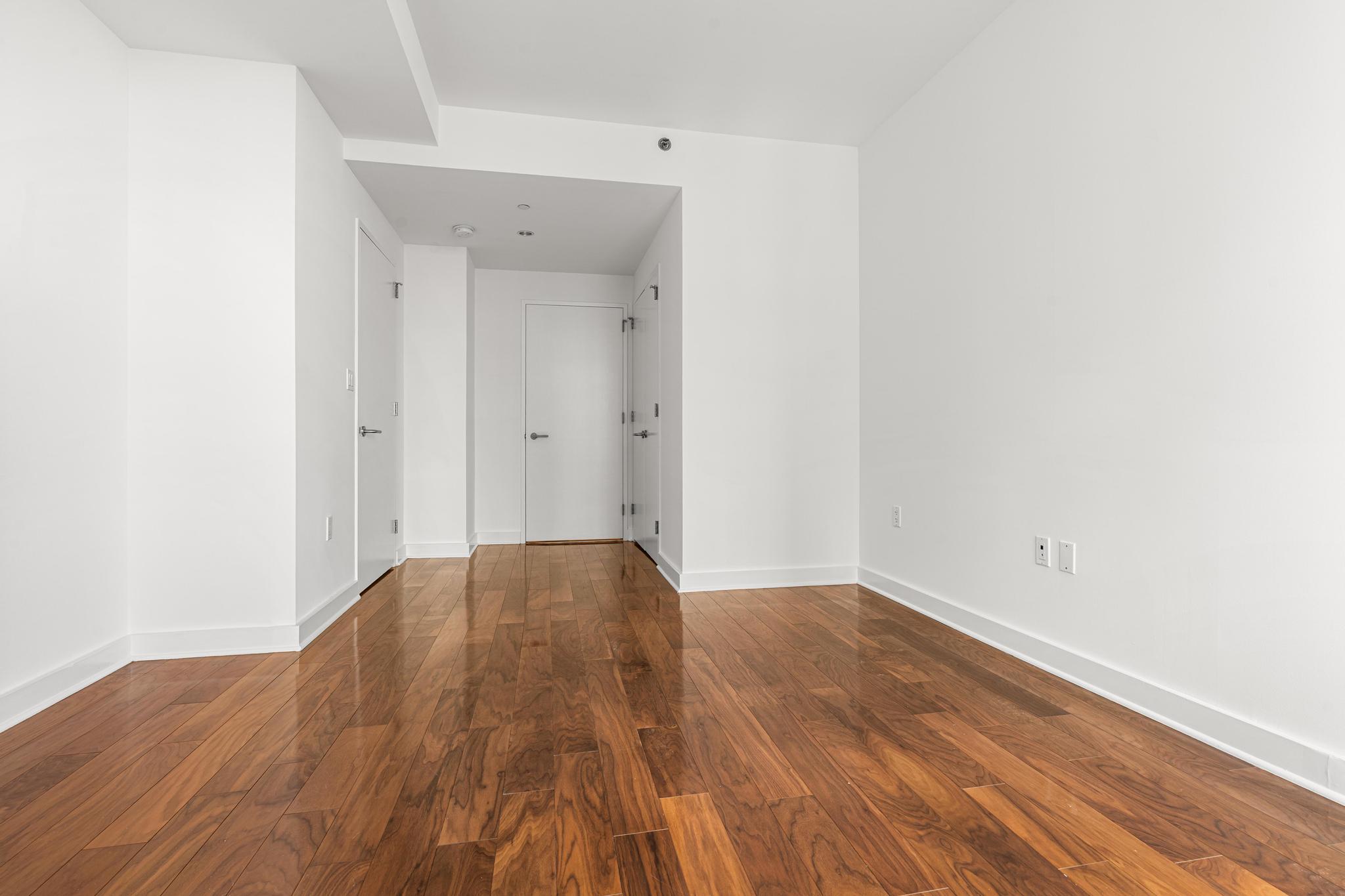 2 Northside Piers, Unit 5U Brooklyn, NY 11249 - Photo 9 of 12 a view of empty room with wooden floor