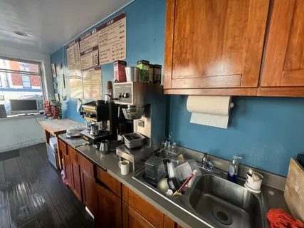 a kitchen with a sink stove and cabinets