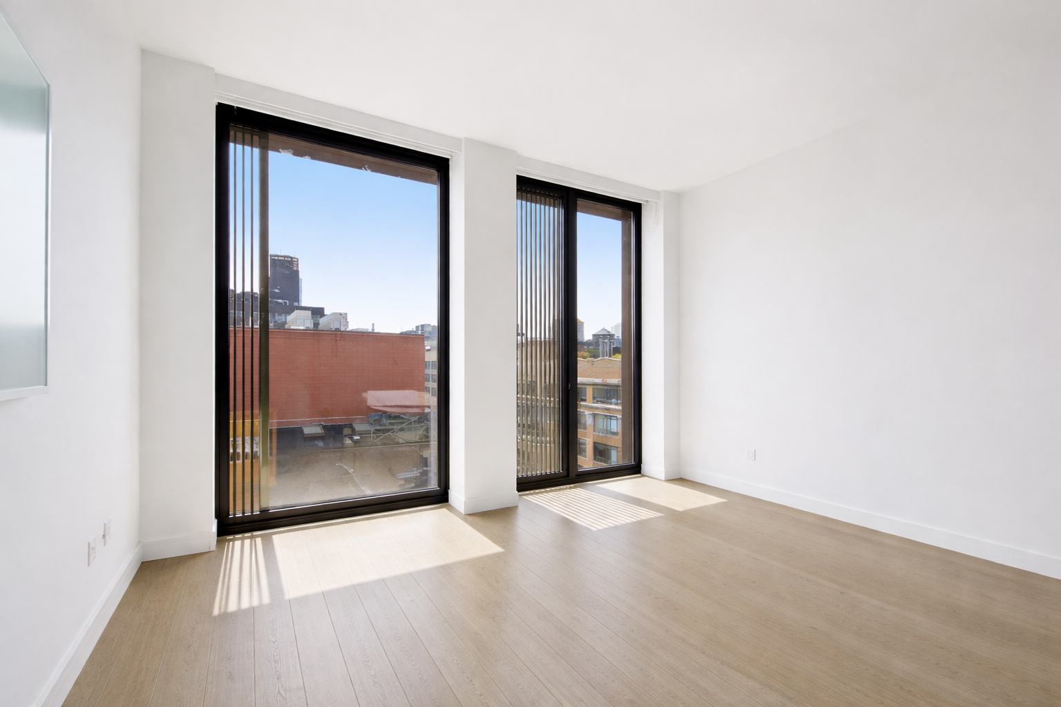 100 Barrow Street, Unit 11A Manhattan, NY 10014 - Photo 10 of 16 a view of an empty room with glass door
