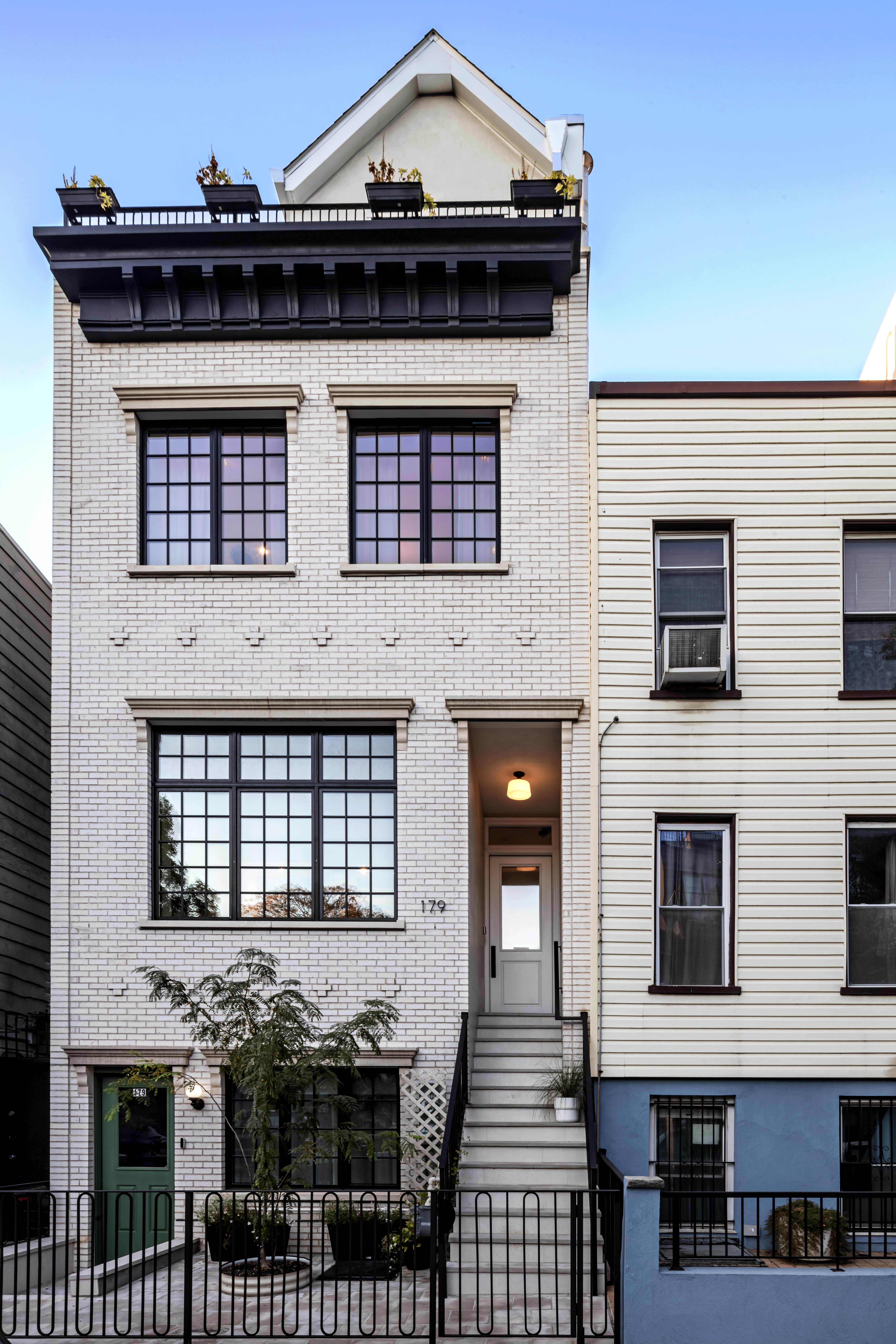 179 Devoe Street, Unit 2 Brooklyn, NY 11211 - Photo 18 of 19 a front view of a house with glass windows