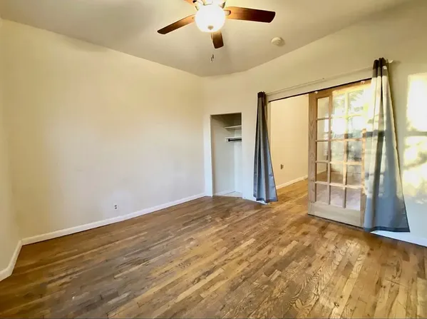 a view of an empty room with a window