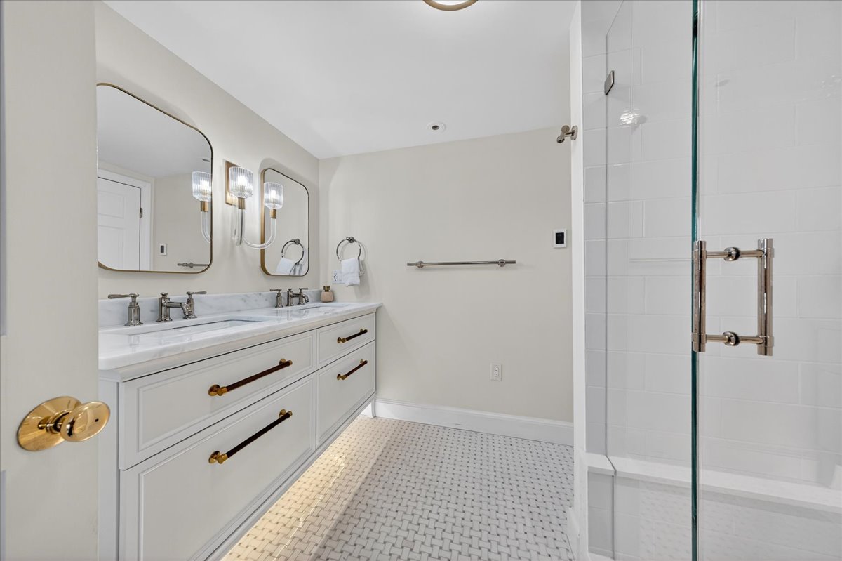 6 Studley Road Hingham, MA 02043 - Photo 16 of 27 a bathroom with a double vanity sink a mirror and shower
