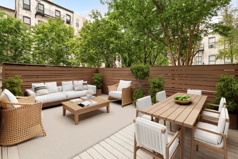 a view of a patio with couches chairs and a table