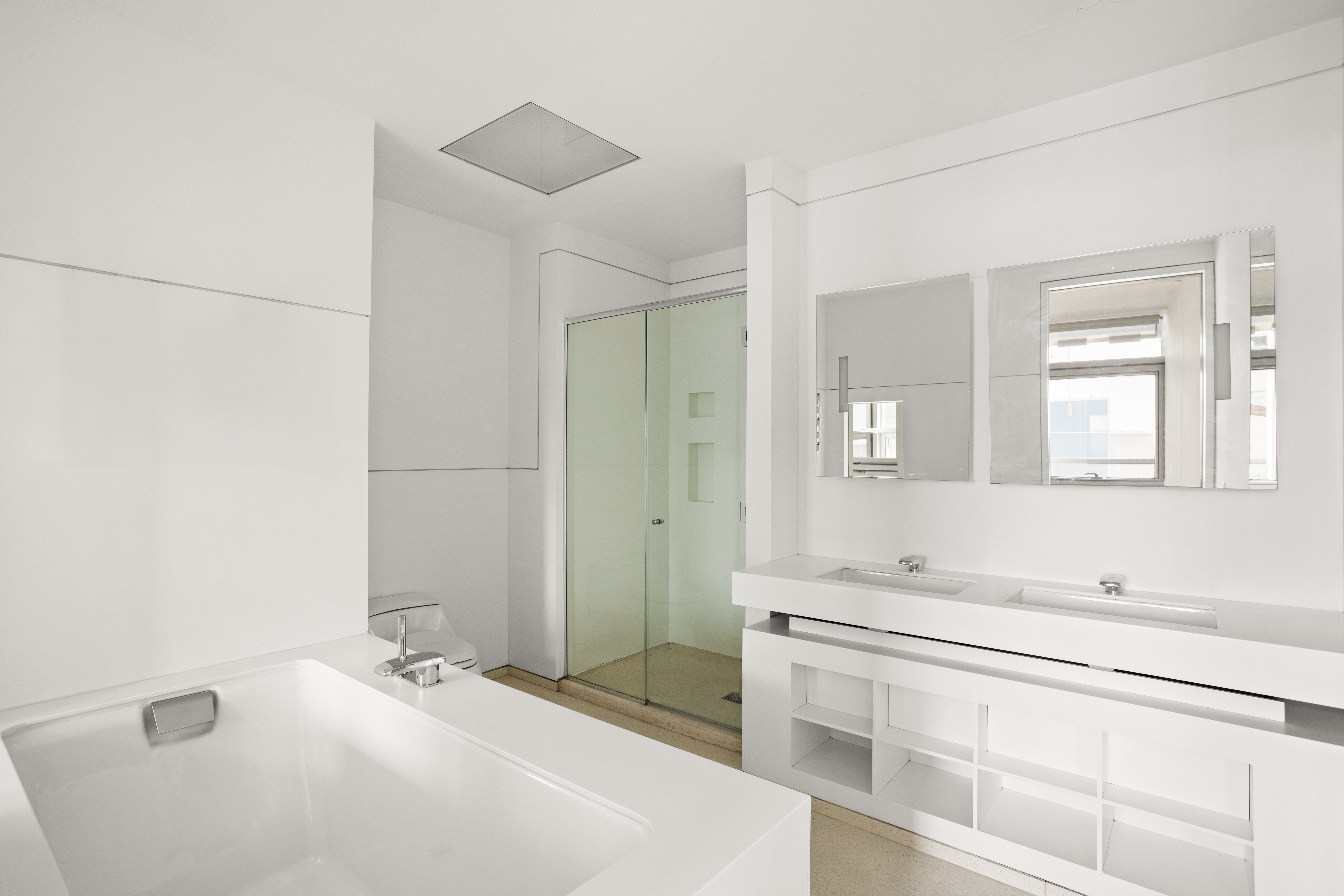 100 11th Avenue, Unit 5A Manhattan, NY 10011 - Photo 5 of 20 a bathroom with a tub sink and mirror