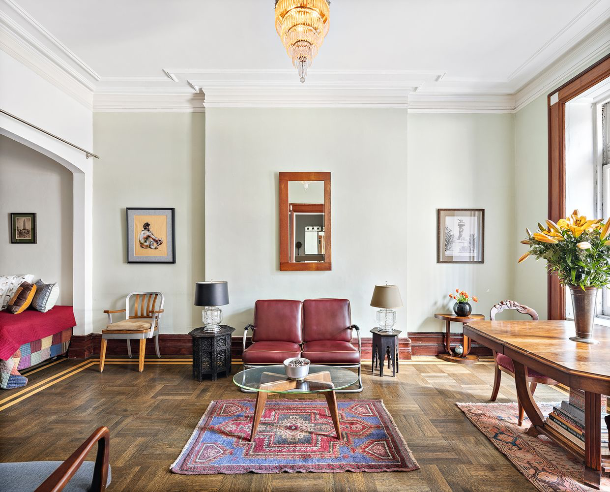 a living room with furniture a rug and a window