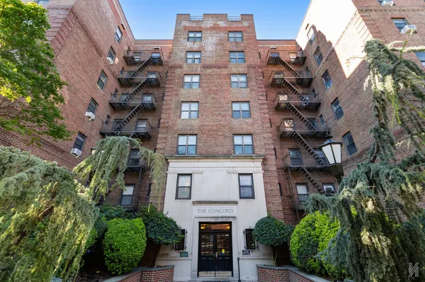 a large building with a clock on the side of it