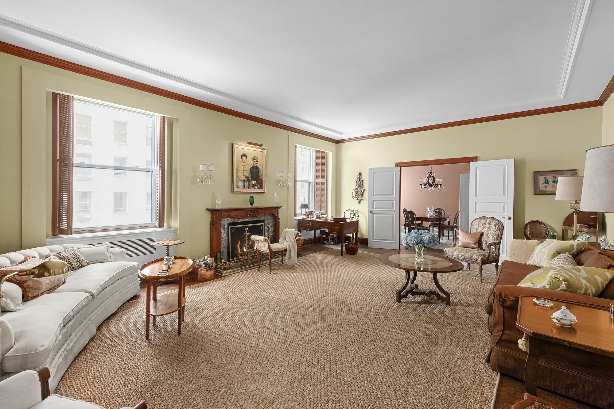 31 East 72nd Street, Unit 7B Manhattan, NY 10021 - Photo 4 of 13 a living room with furniture and a fireplace