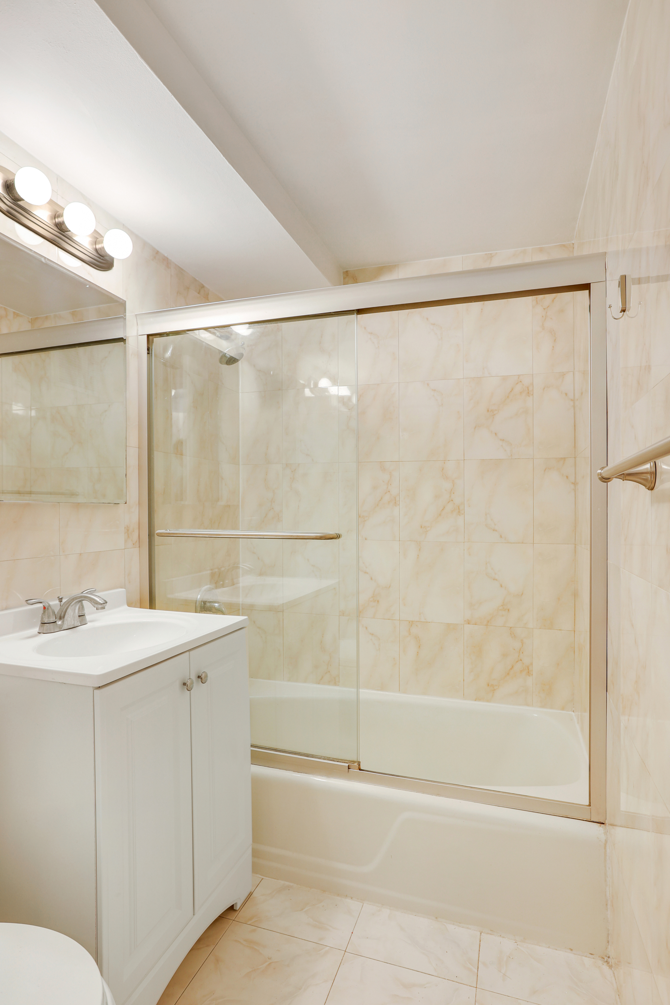 141 West 94th Street, Unit 1F Manhattan, NY 10025 - Photo 9 of 9 a bathroom with a sink and a mirror