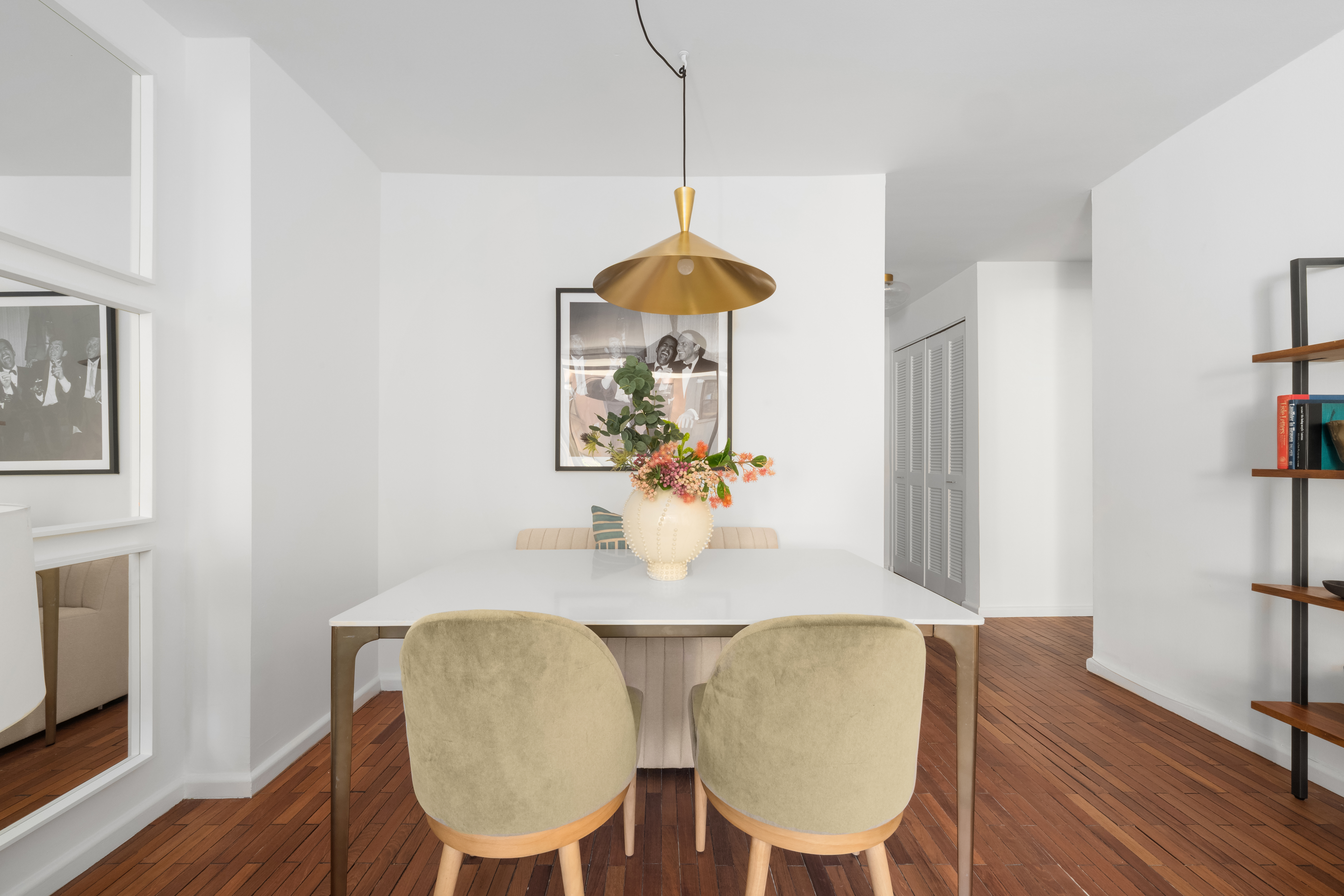 150 East 85th Street, Unit 3F Manhattan, NY 10028 - Photo 6 of 15 a dining room with furniture and wooden floor