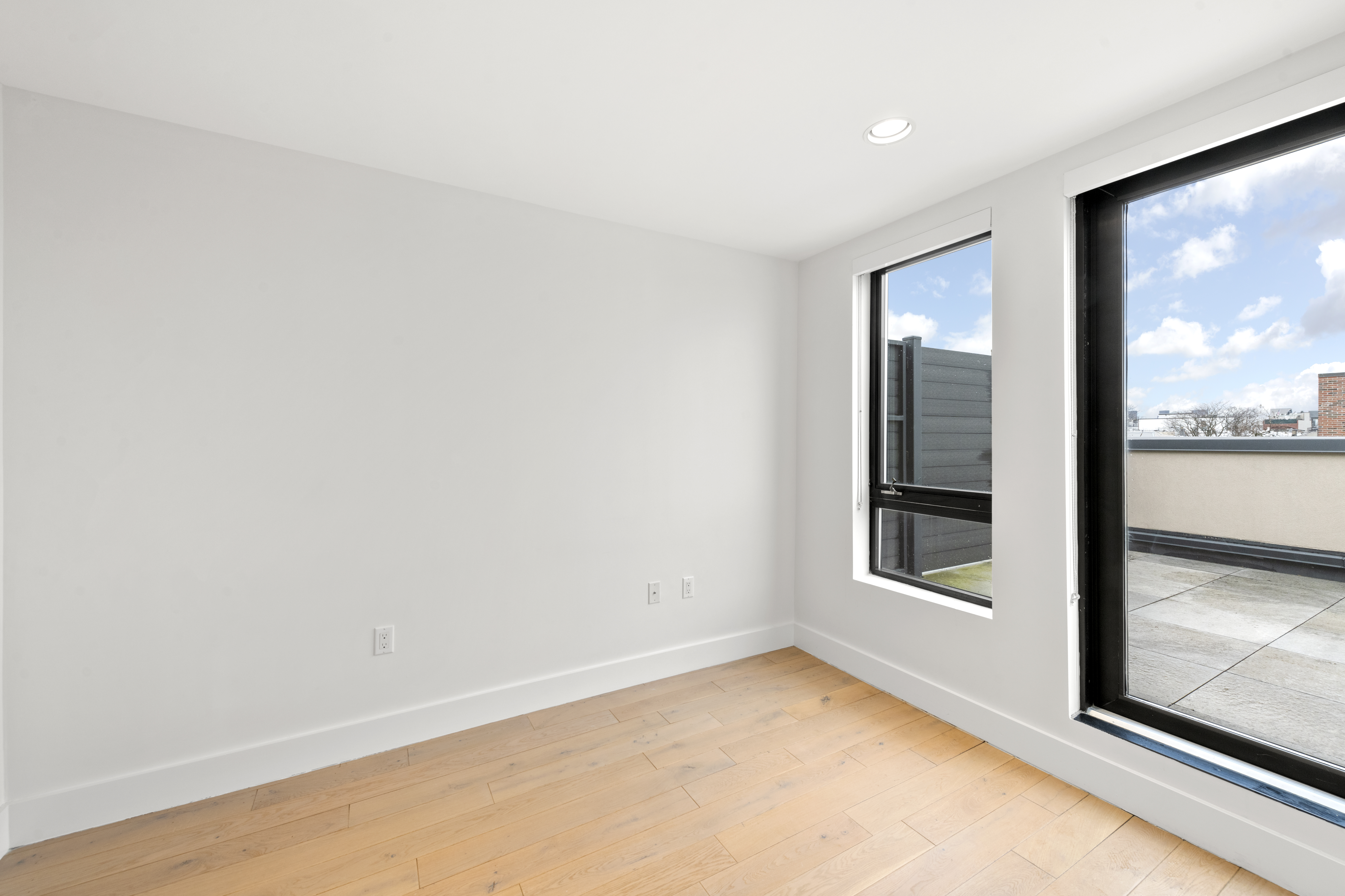 1164 Greene Avenue, Unit PHA Brooklyn, NY 11221 - Photo 7 of 13 an empty room with window