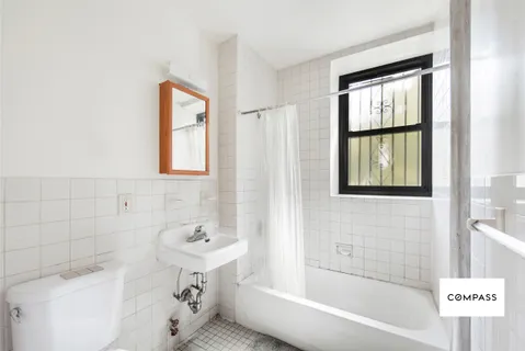 a bathroom with a bathtub and a sink