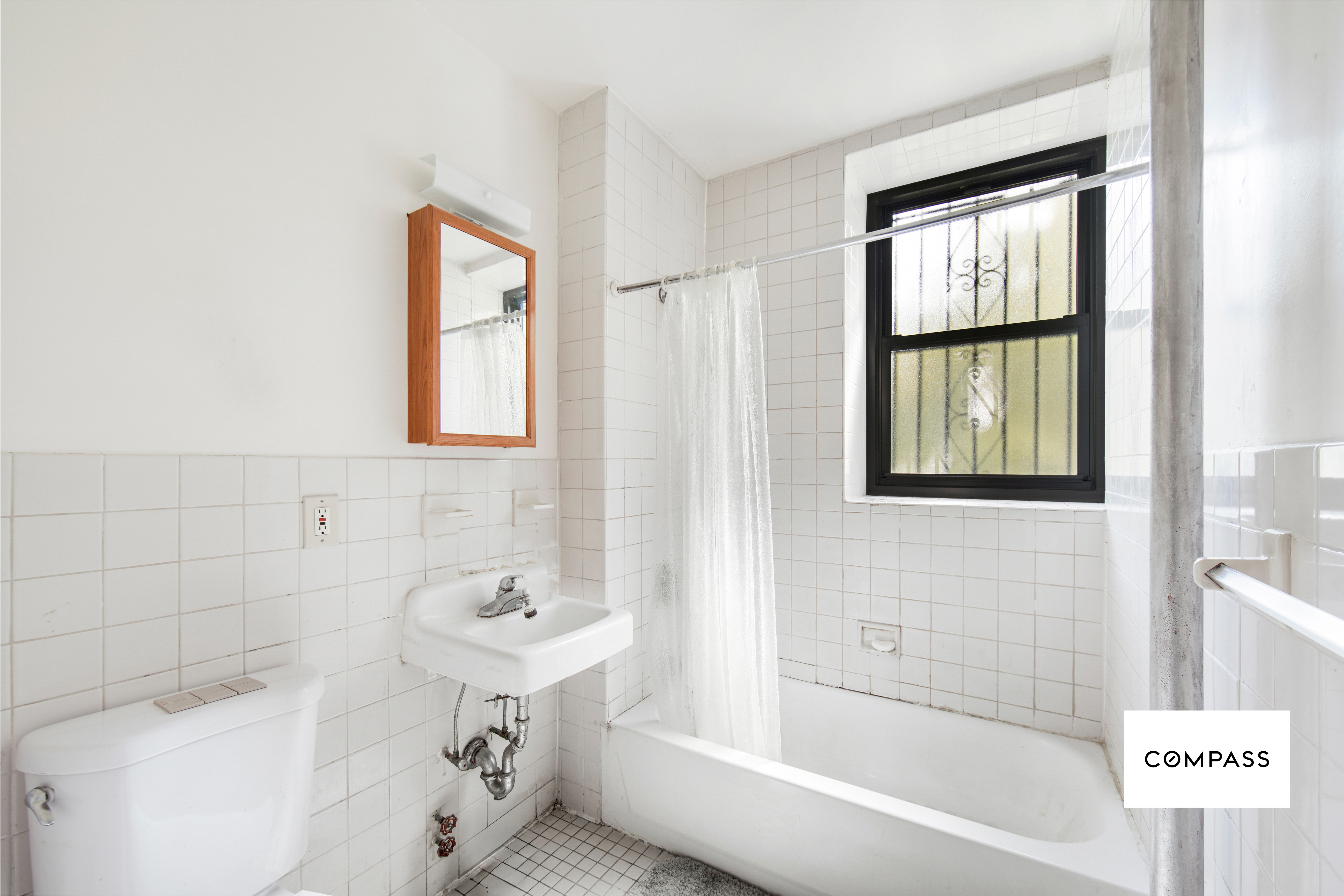 80 St Nicholas Avenue, Unit 1E Manhattan, NY 10026 - Photo 6 of 6 a bathroom with a bathtub and a sink