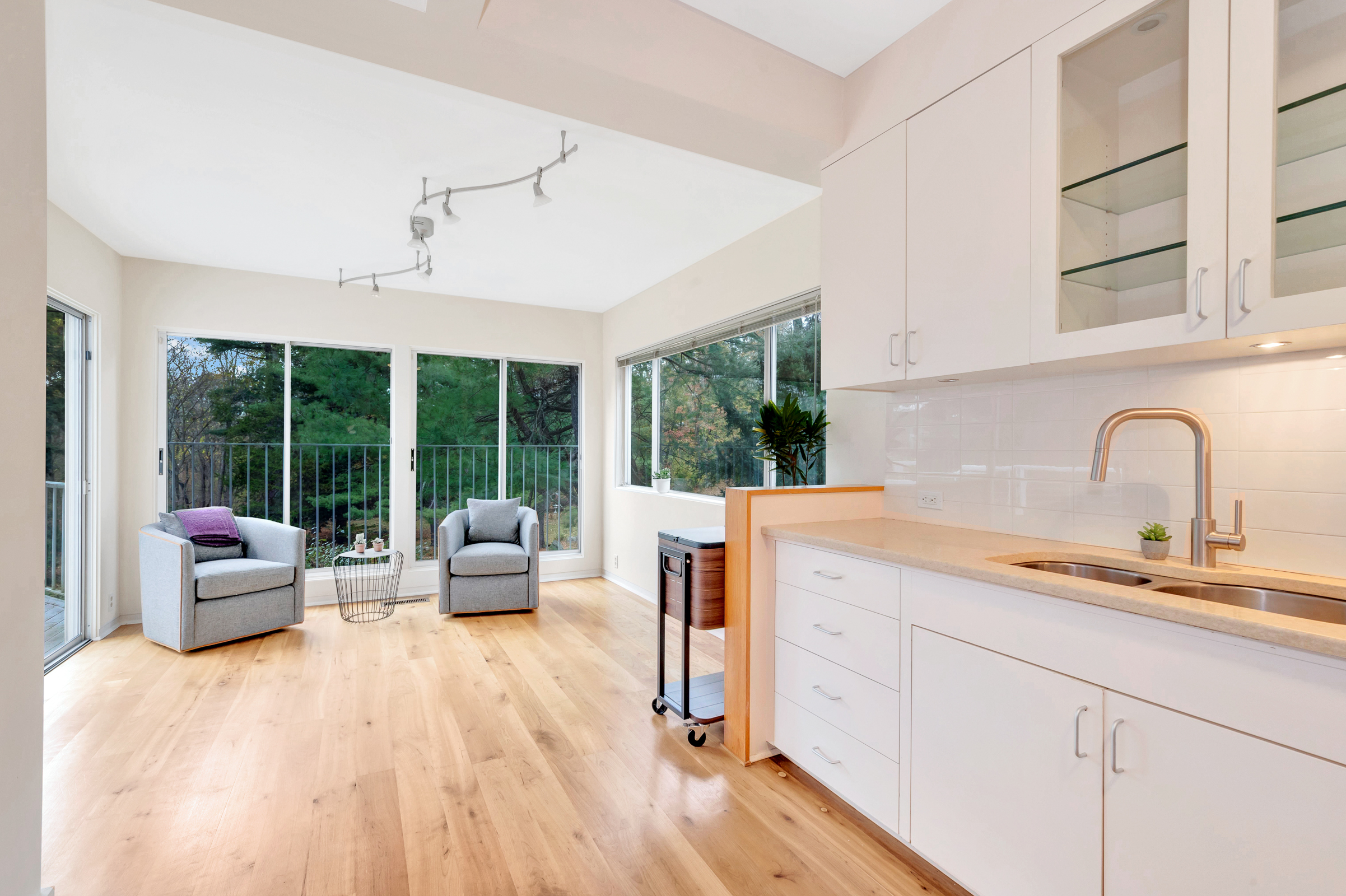 5 Field Road Lexington, MA 02421 - Photo 7 of 17 a view of center kitchen with a sink and living room next to a large window