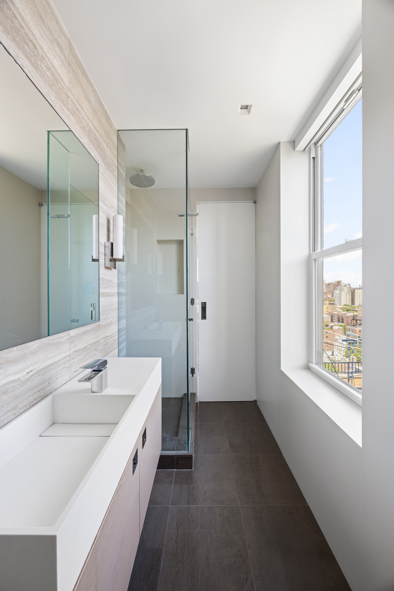 24 5th Avenue, Unit PH1701 Manhattan, NY 10011 - Photo 18 of 24 a spacious bathroom with a tub sink and mirror