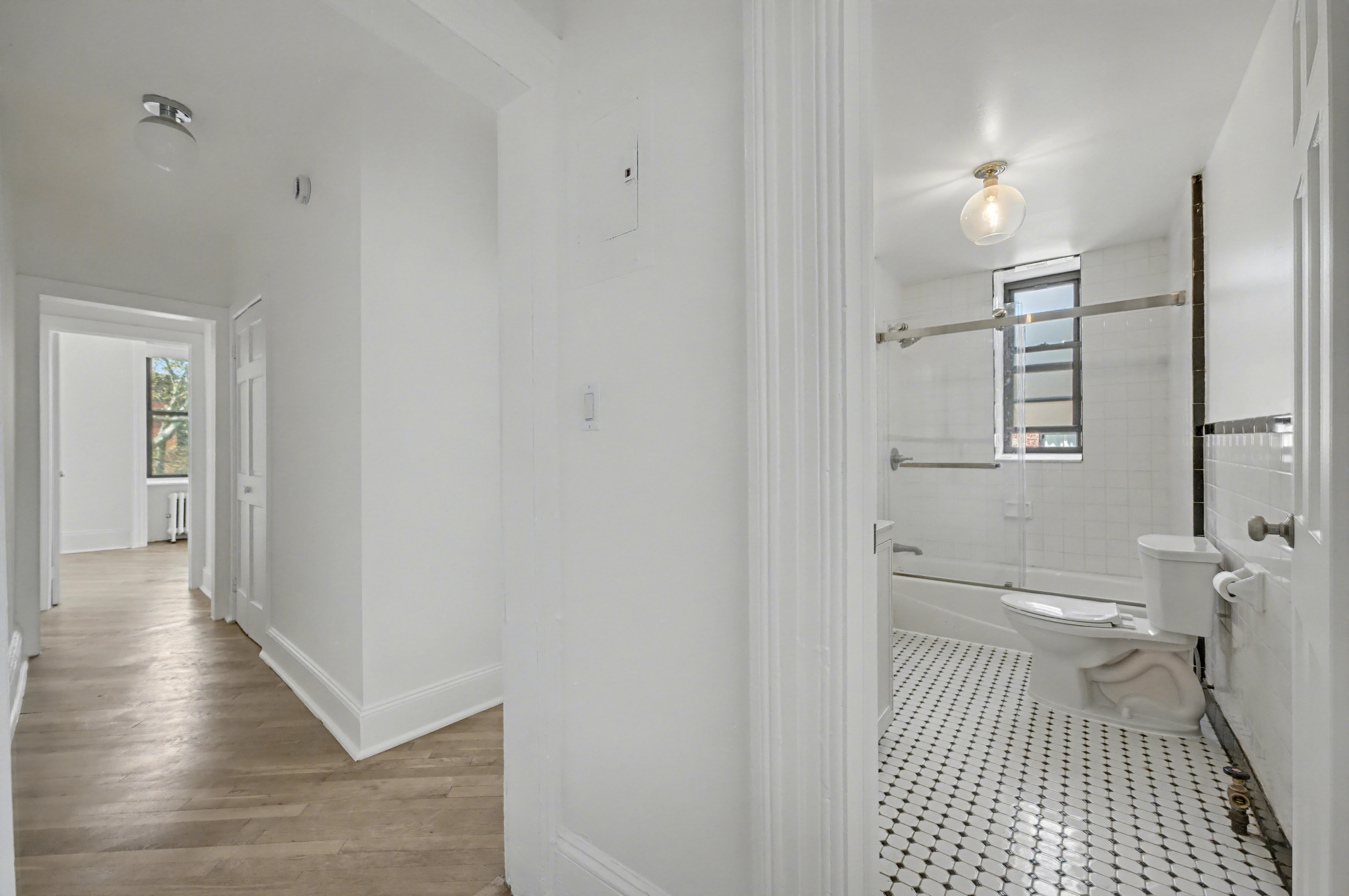 261 Clinton Street, Unit 3 Brooklyn, NY 11201 - Photo 10 of 12 a bathroom with a toilet and a shower