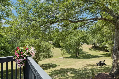 a view of a back yard of the house