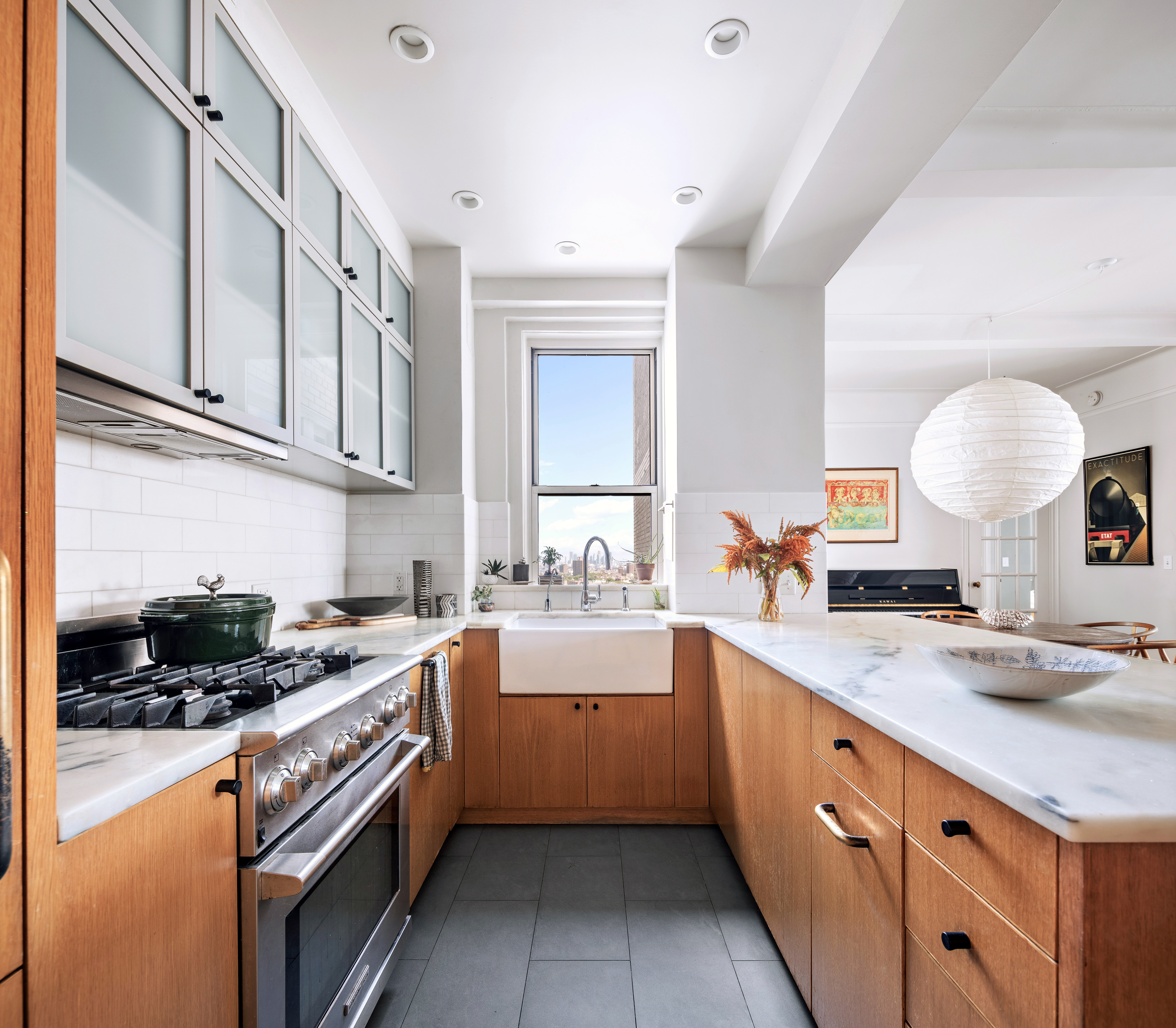 41 Eastern Parkway, Unit 11E Brooklyn, NY 11238 - Photo 4 of 14 a kitchen with a sink stove and cabinets