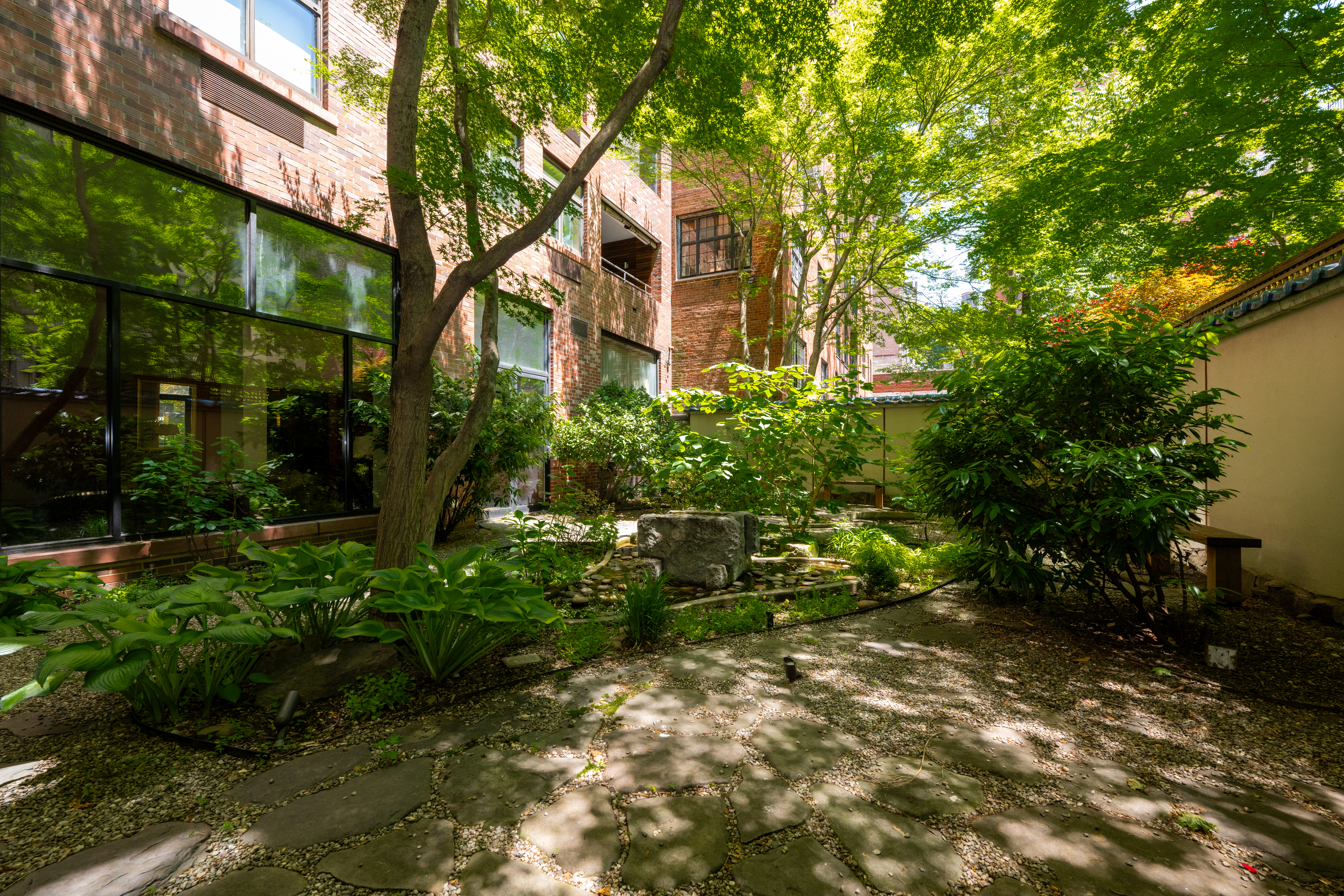124 East 79th Street, Unit 7D Manhattan, NY 10075 - Photo 22 of 26 a front view of a house with a yard