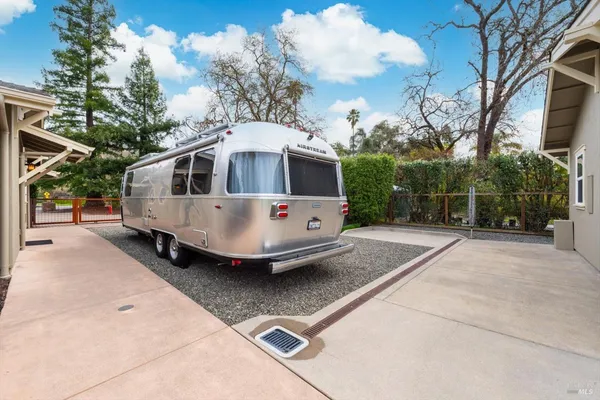 an aerial view of residential houses with outdoor space and river