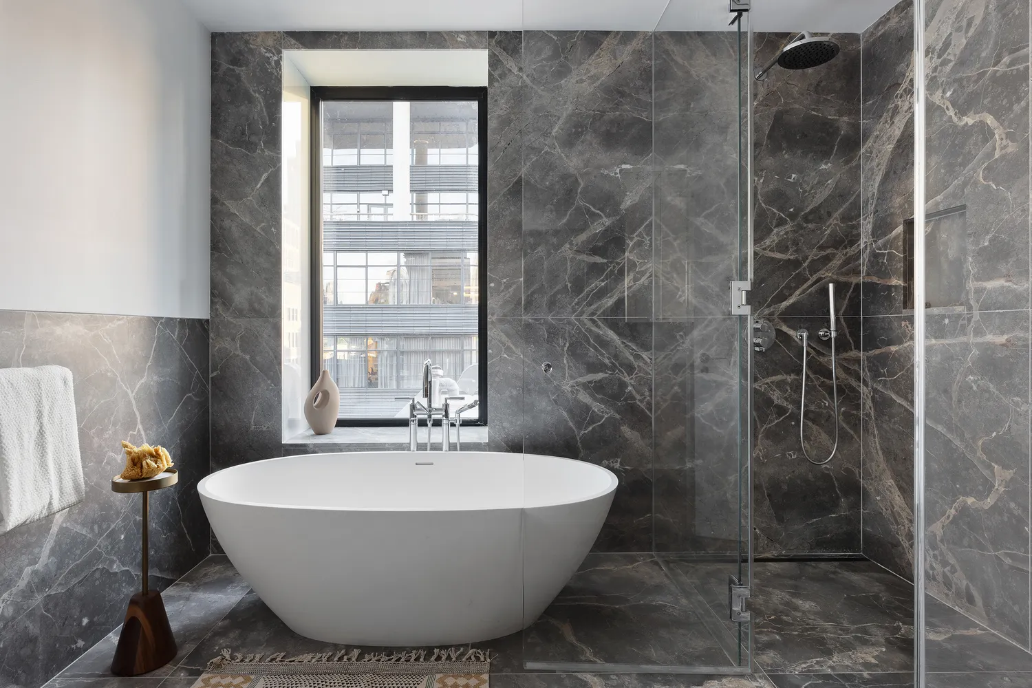 a bathroom with a bathtub and shower