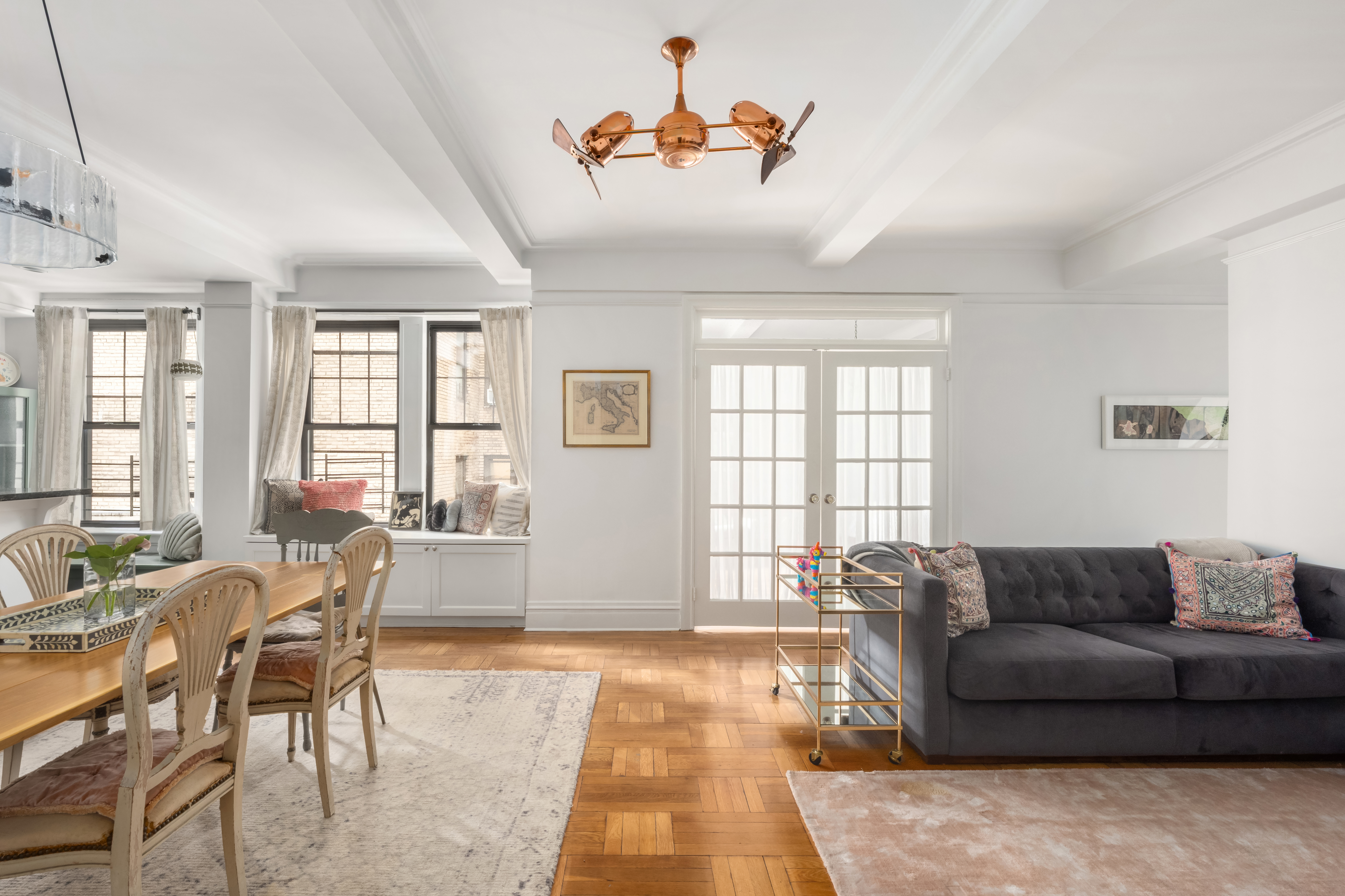 170 2nd Avenue, Unit 4A Manhattan, NY 10003 - Photo 1 of 11 a living room with furniture and a window
