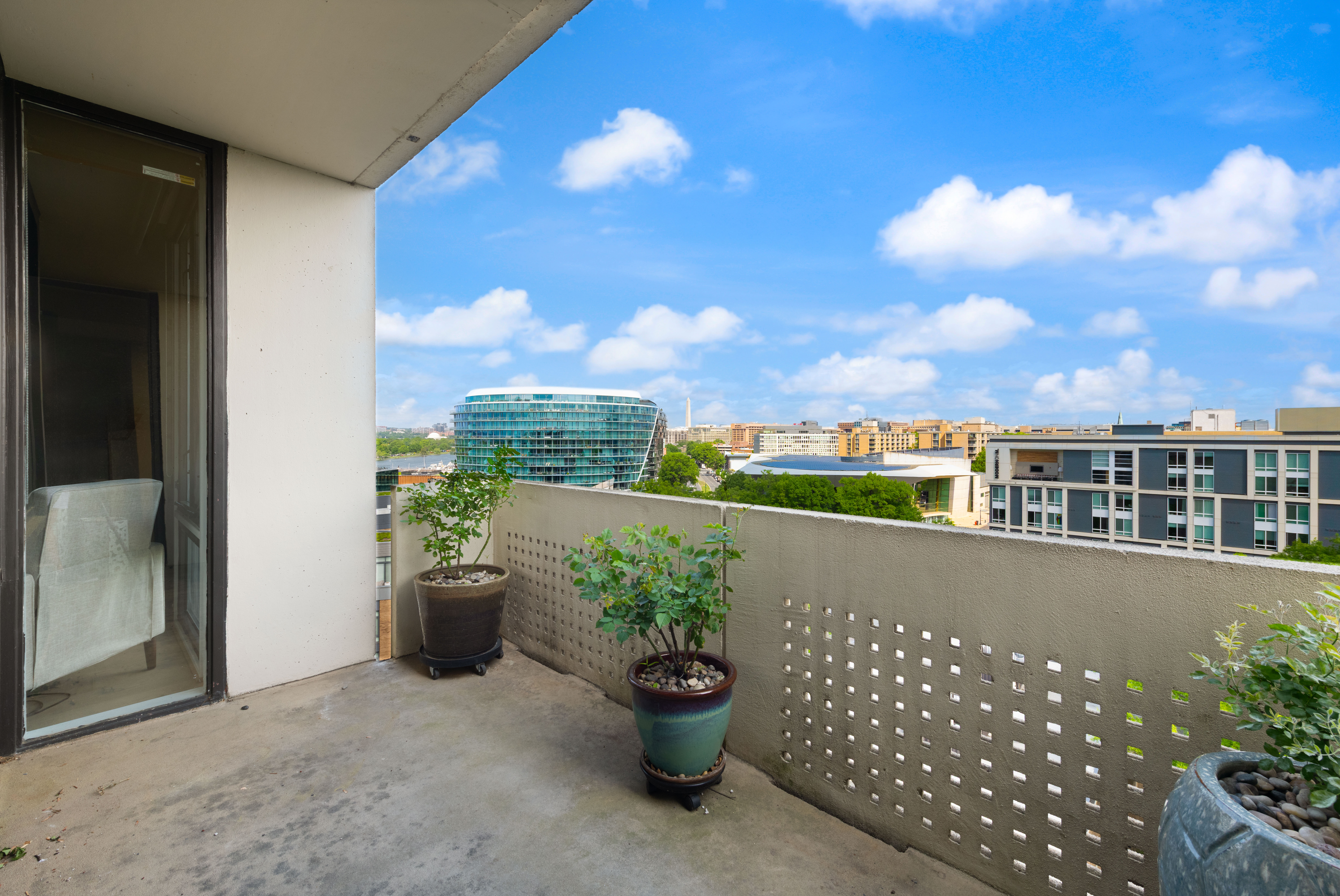 490 M Street Southwest, Unit W802 Washington, DC 20024 - Photo 3 of 24 a view of a terrace with a chair