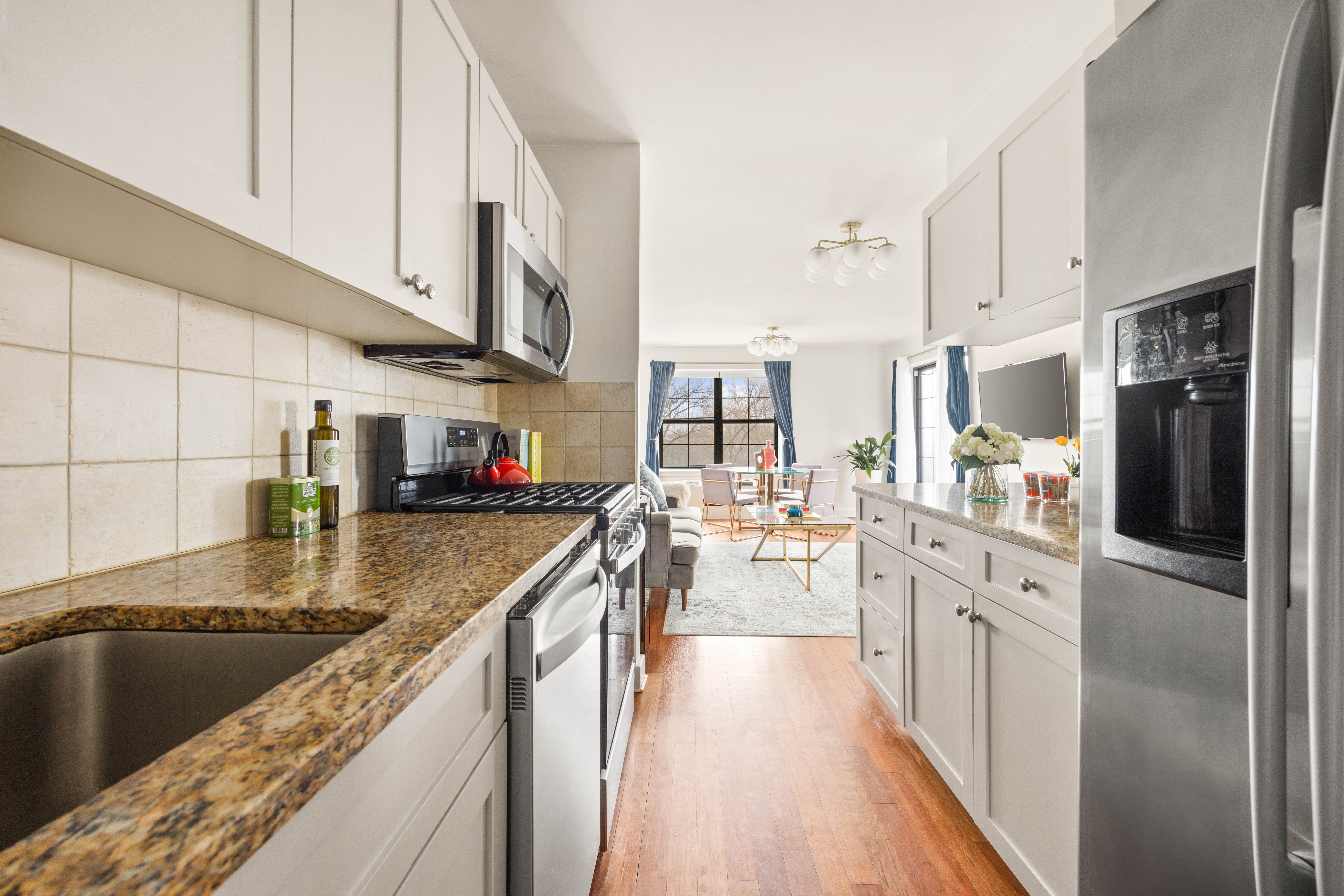 93 Rapelye Street, Unit 3D Brooklyn, NY 11231 - Photo 2 of 11 a large kitchen with stainless steel appliances granite countertop a lot of counter space and wooden floors