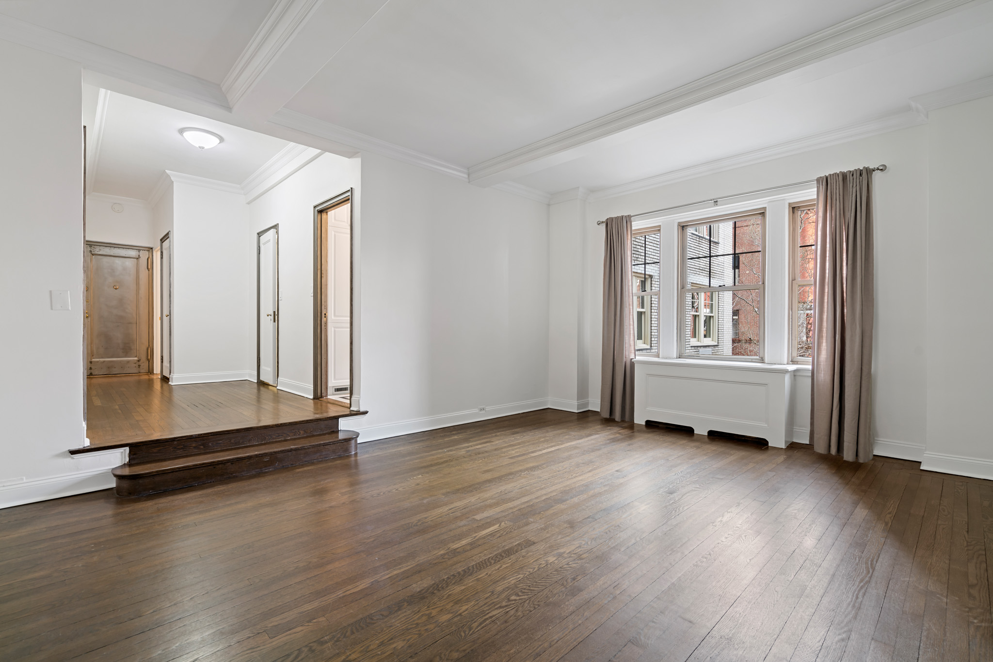 299 West 12th Street, Unit 3JH Manhattan, NY 10014 - Photo 9 of 15 an empty room with wooden floor and windows