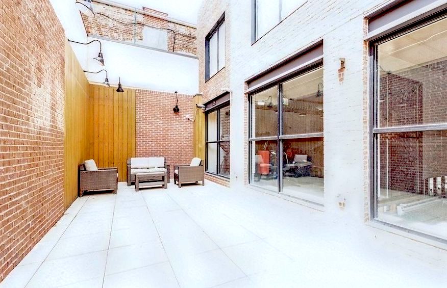 21-10 44th Drive, Unit 6C Queens, NY 11101 - Photo 14 of 17 a view of living room with a table and chairs