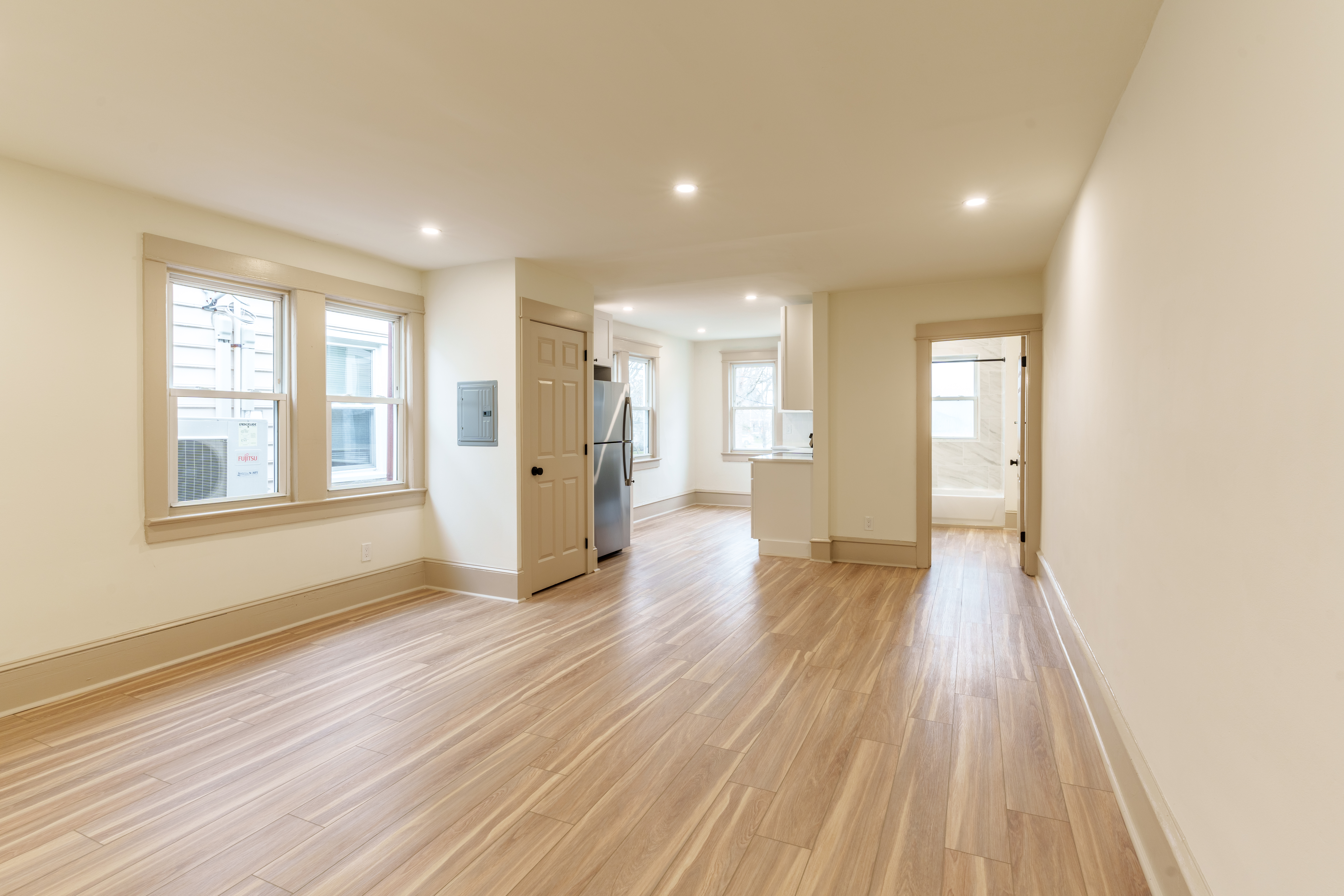 423 North Haddon Avenue Haddonfield, NJ 08033 - Photo 5 of 16 a view of an empty room with wooden floor and a window