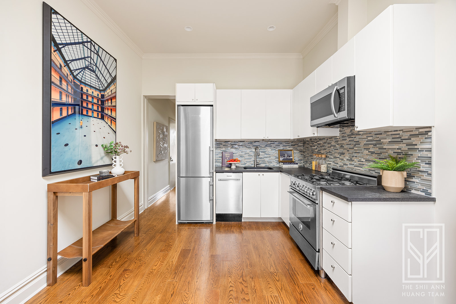 307 7th Street, Unit 4L Brooklyn, NY 11215 - Photo 6 of 15 a kitchen with stainless steel appliances granite countertop a stove and a refrigerator