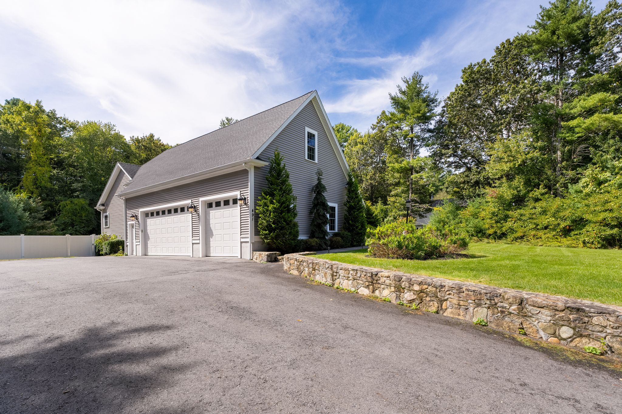 491 Pine Street Bridgewater, MA 02324 - Photo 15 of 18 a front view of a house with a yard and garage