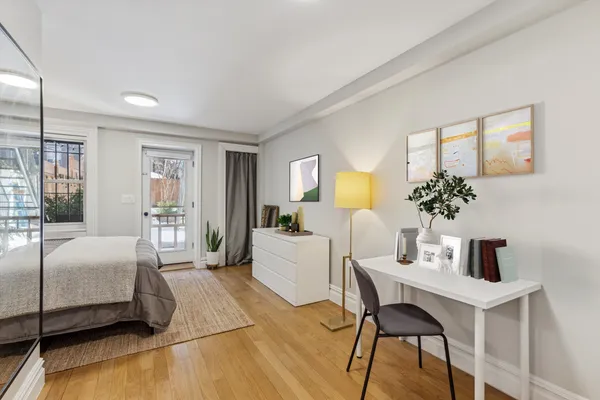 a bedroom with a bed and a table