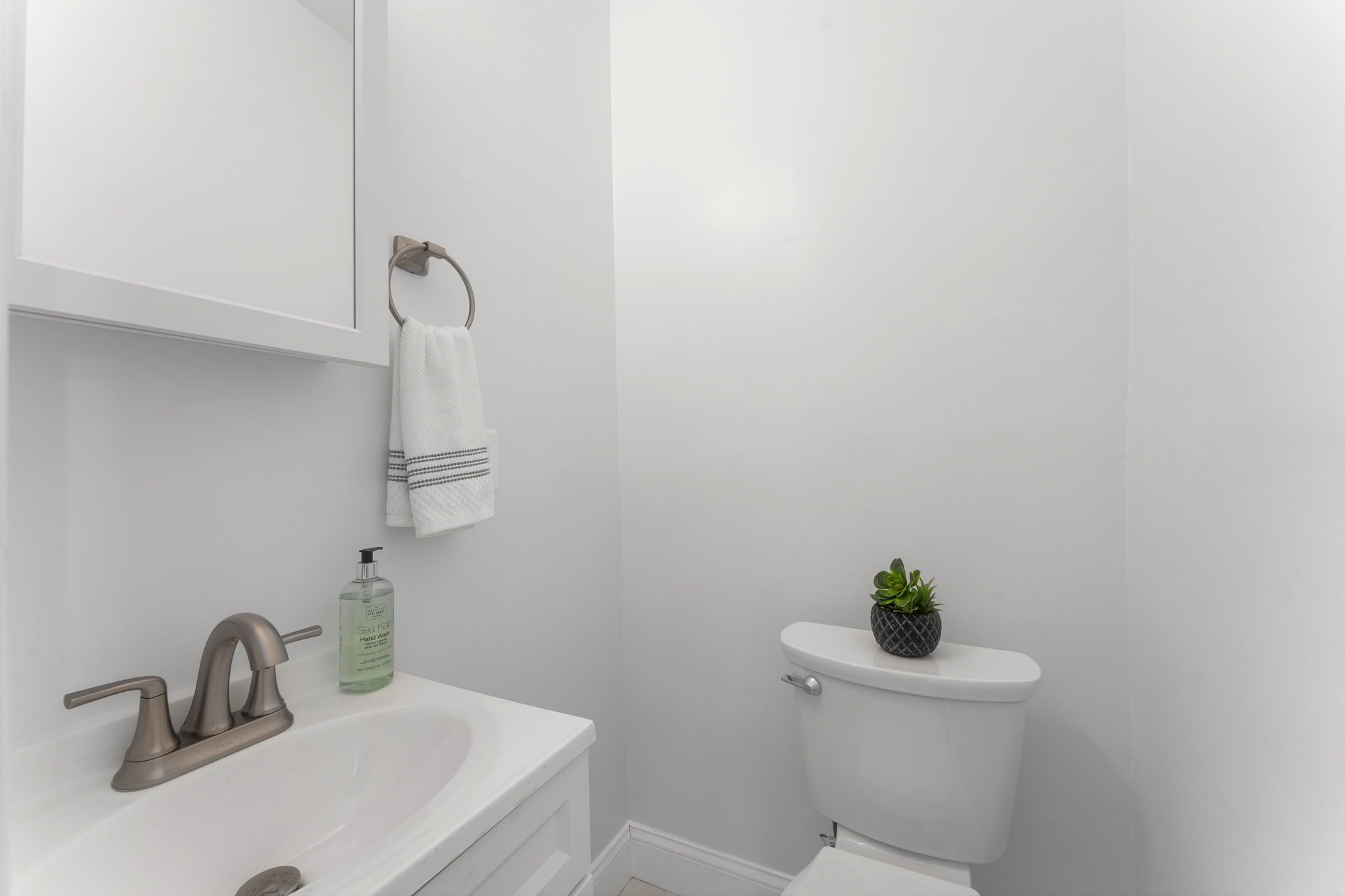 1325 Locust Road Northwest Washington, DC 20012 - Photo 23 of 56 a bathroom with a sink a toilet and a mirror