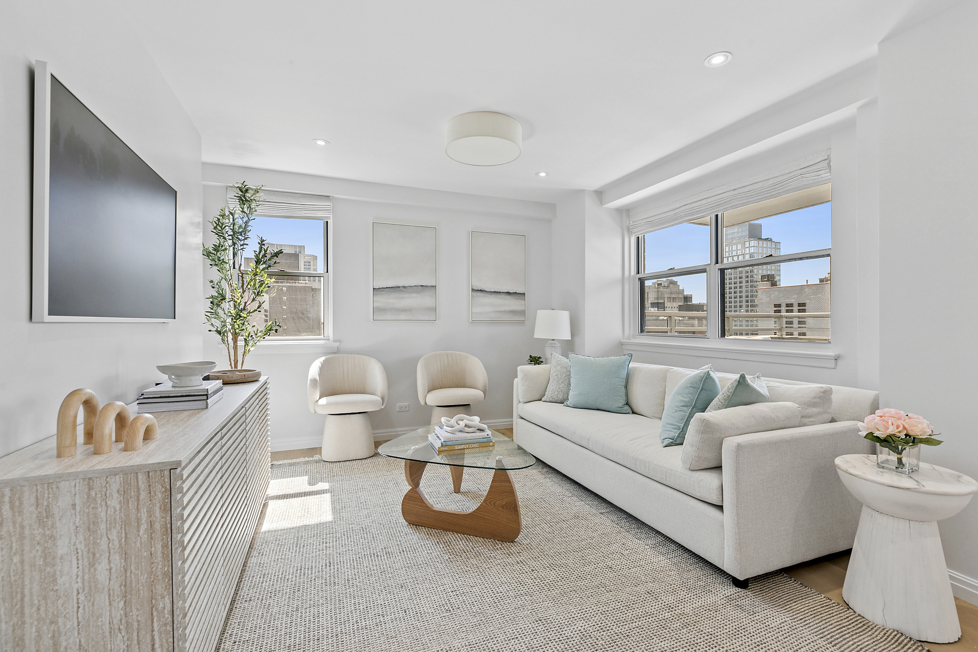 300 East 71st Street, Unit 17DEF Manhattan, NY 10021 - Photo 2 of 16 a living room with furniture and a window
