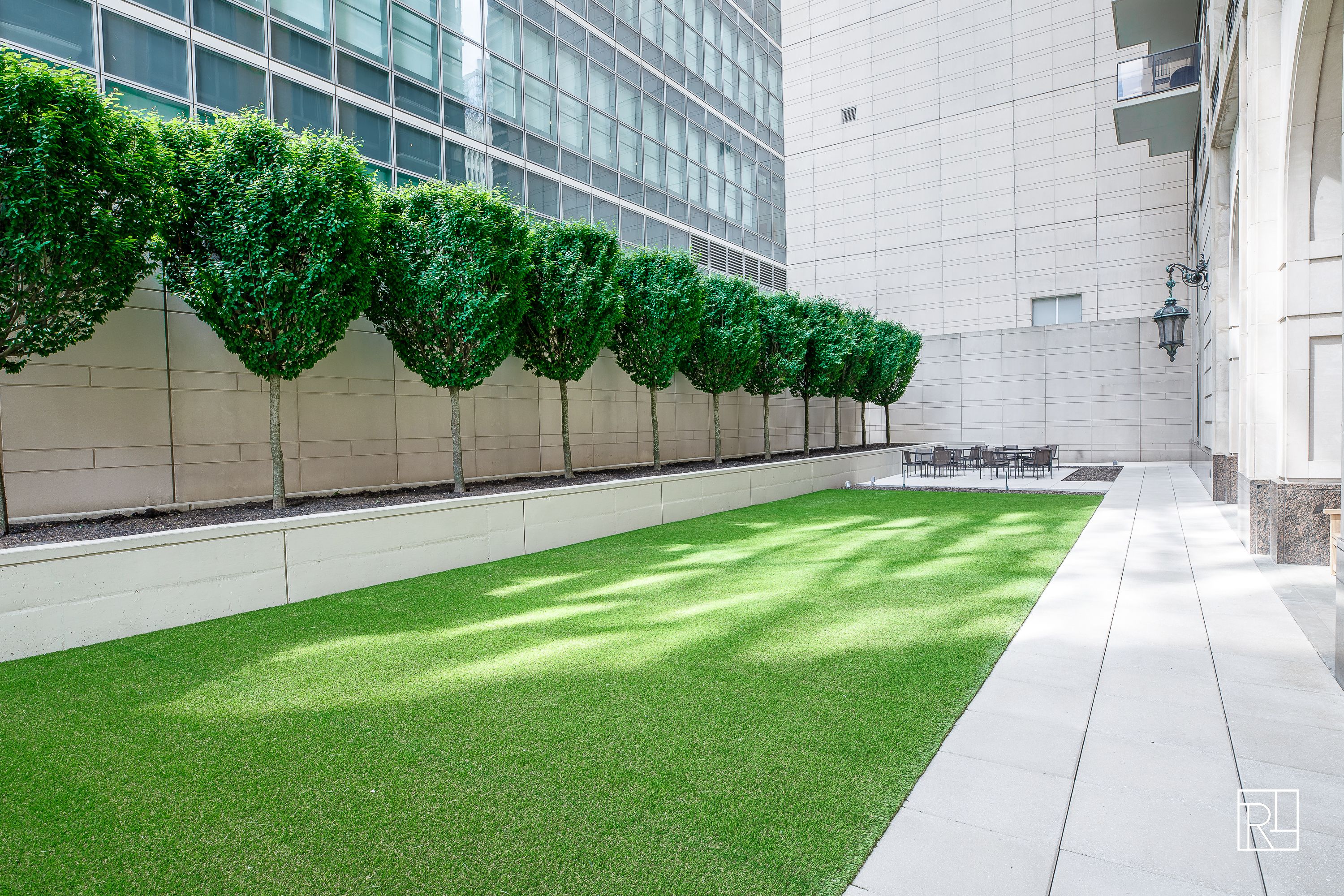 161 West 61st Street, Unit 12D Manhattan, NY 10023 - Photo 14 of 15 a view of a backyard with a garden