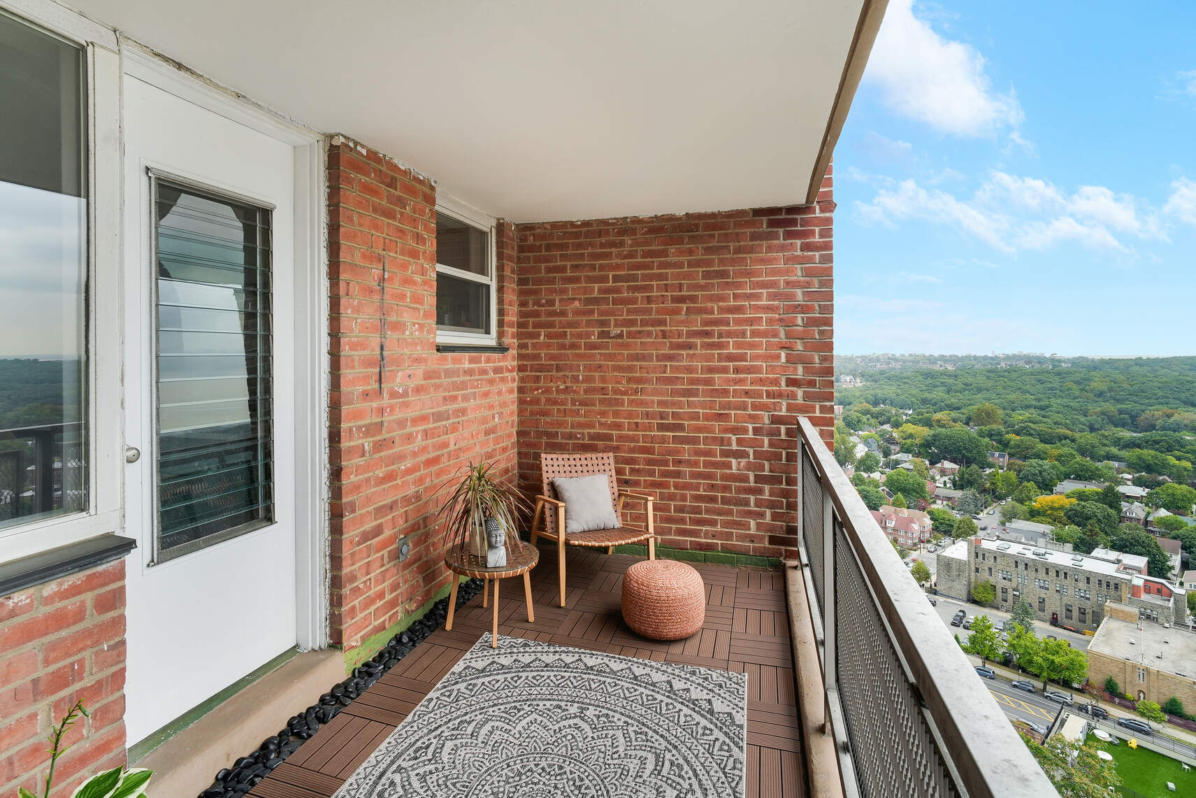 5800 Arlington Avenue, Unit 17D Bronx, NY 10471 - Photo 9 of 14 a view of a balcony with two chairs and a rug