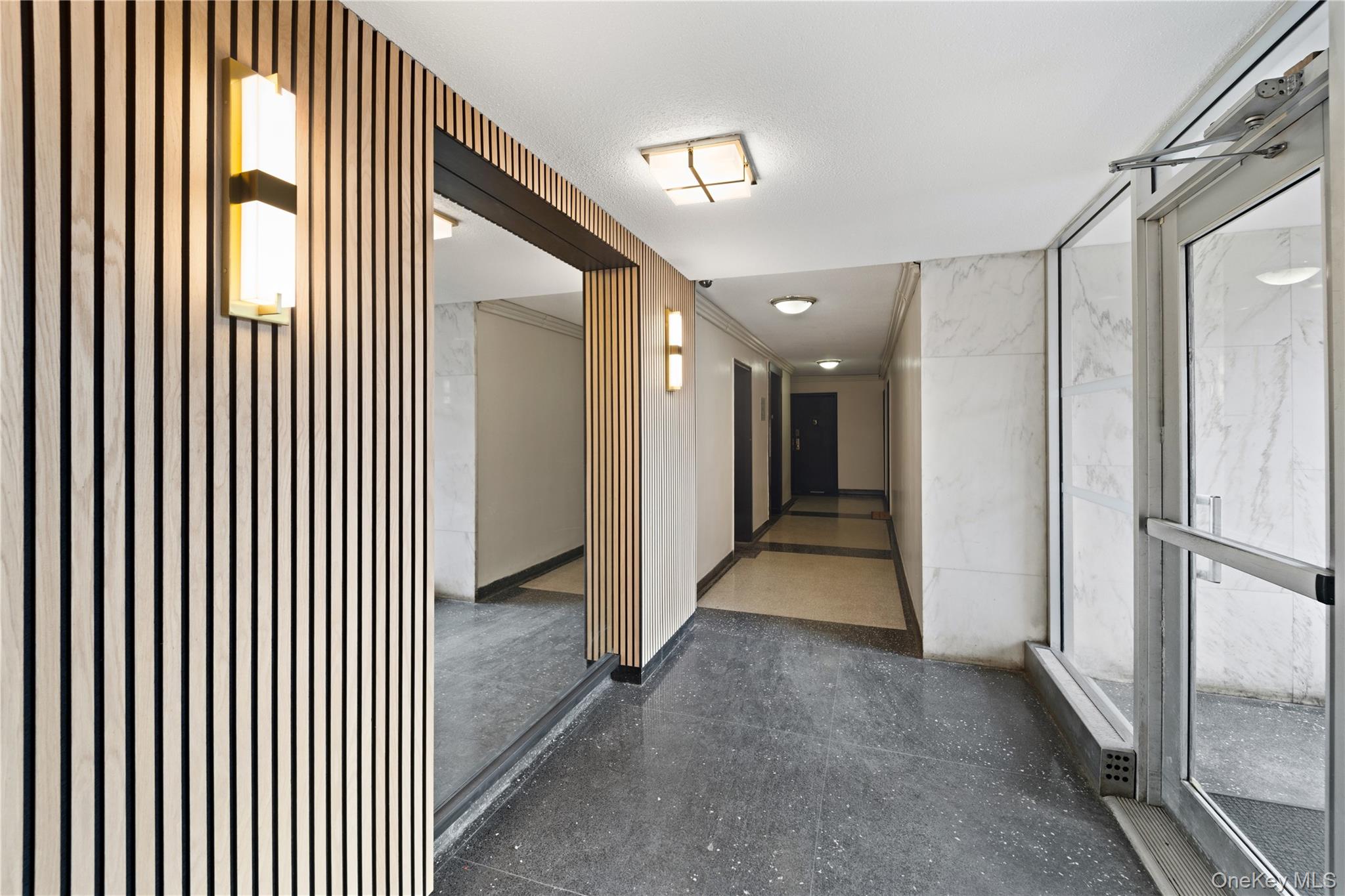 73-11 Bell Boulevard, Unit 2C Queens, NY 11364 - Photo 2 of 16 a view of a hallway with entryway