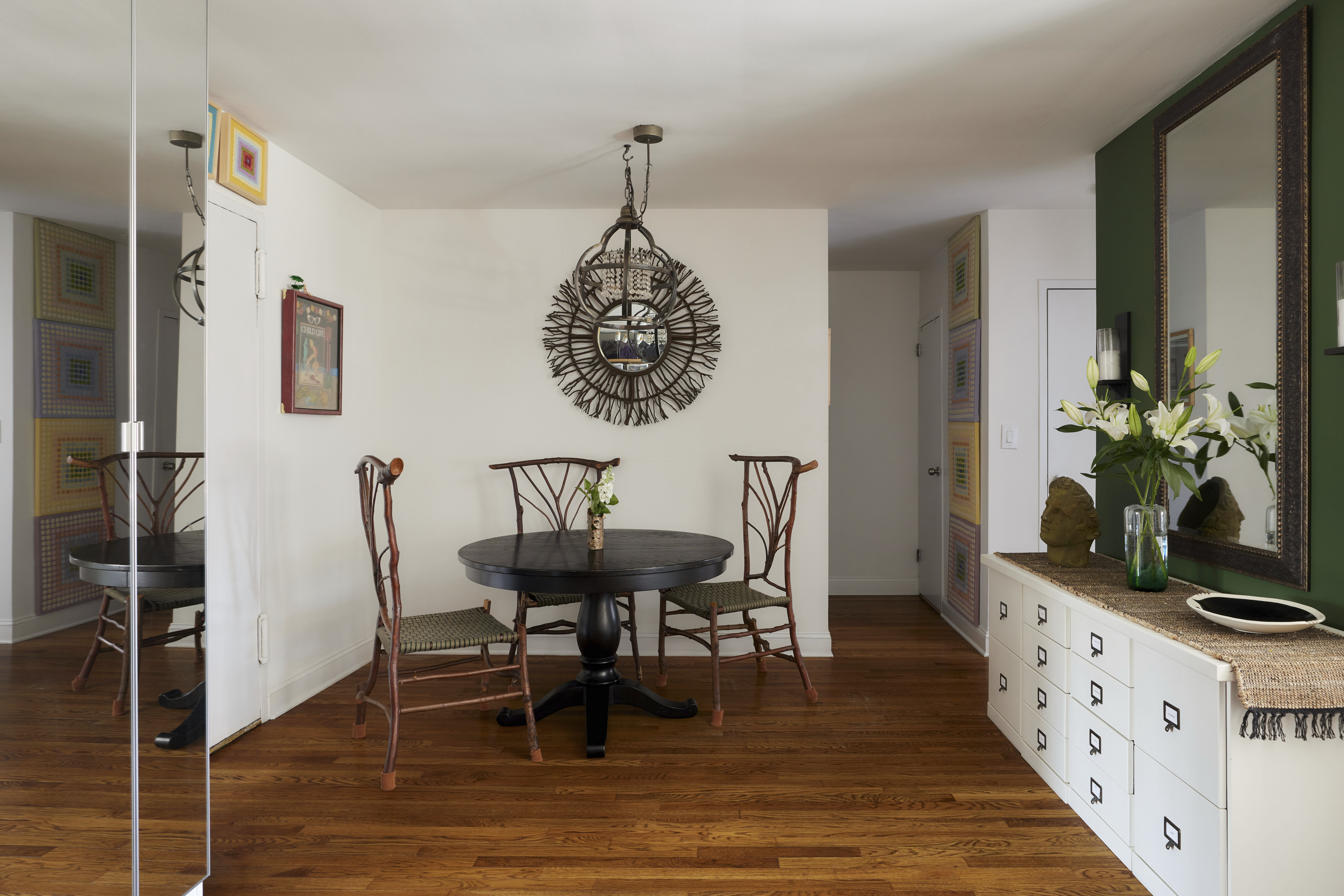 66 Overlook Terrace, Unit 6P Manhattan, NY 10040 - Photo 3 of 10 a dining room with furniture potted plants and wooden floor