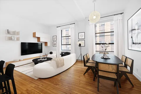 a workspace with furniture and a flat screen tv