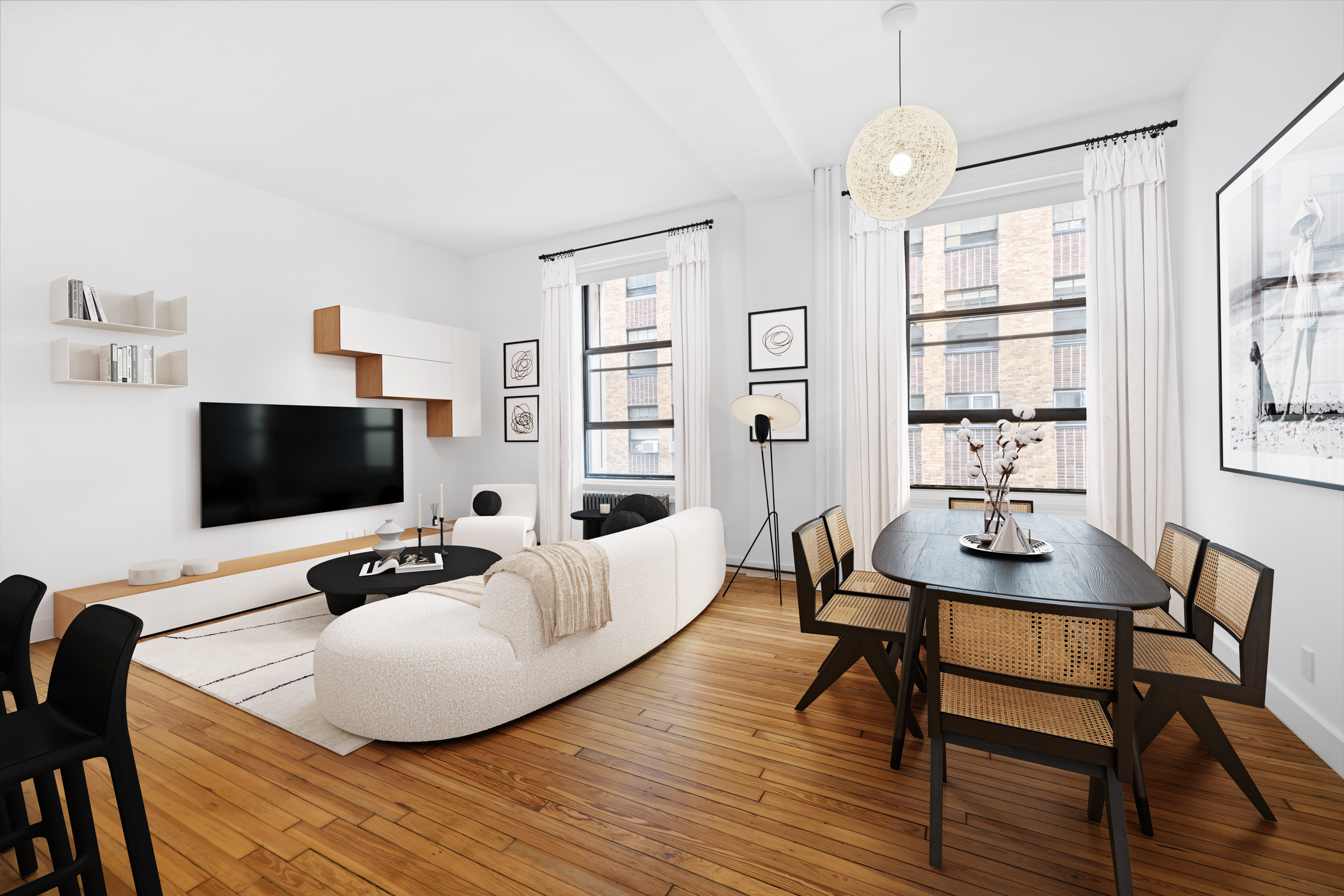 395 Broadway, Unit 5B Manhattan, NY 10013 - Photo 9 of 13 a workspace with furniture and a flat screen tv