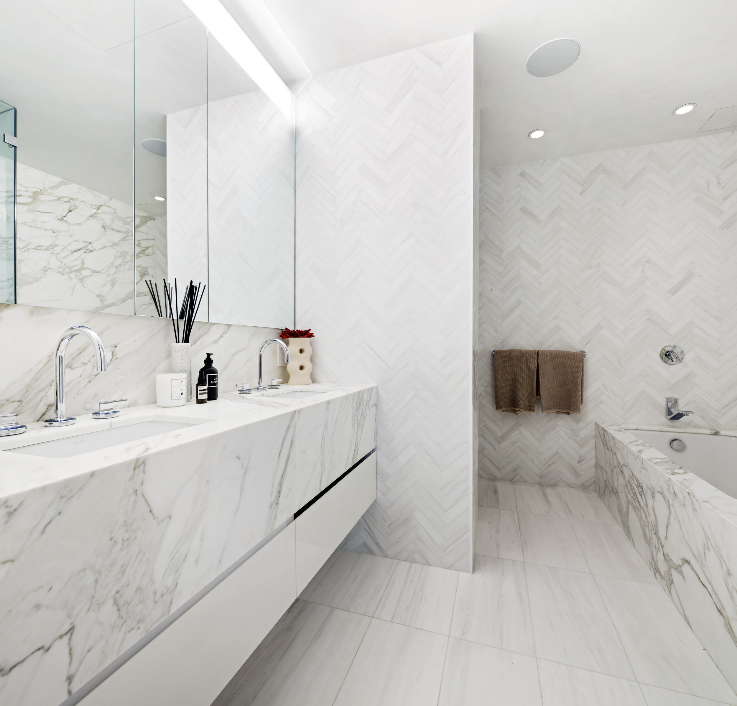 471 Washington Street, Unit 1B Manhattan, NY 10013 - Photo 12 of 17 a bathroom with a sink and a mirror
