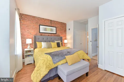 a bedroom with a bed and couch