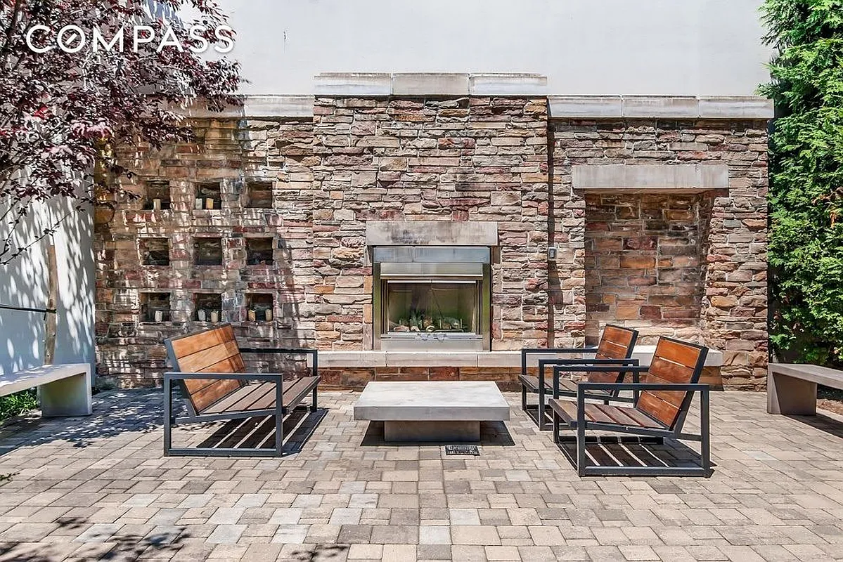 125 North 5th Street, Unit 2D Brooklyn, NY 11249 - Photo 5 of 7 city view of building with outdoor seating