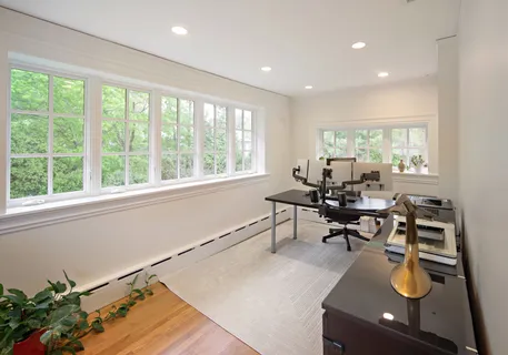 a workspace with table and chairs