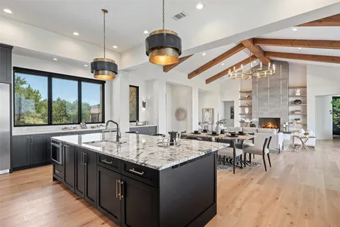 an open kitchen with a table and chairs in it
