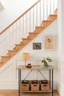 a living room with table tennis air hockey table and arcade game machine