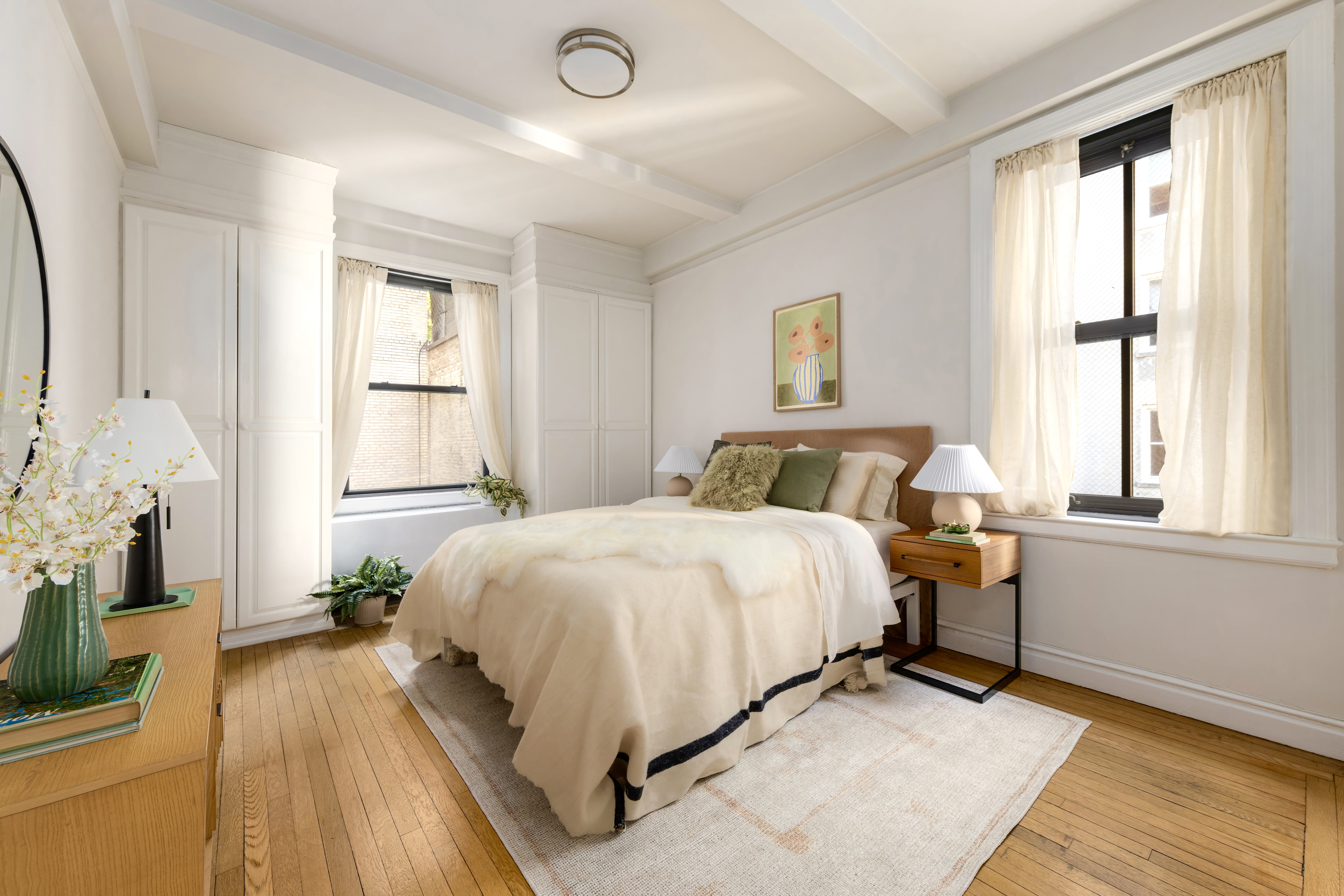 115 East 90th Street, Unit 4E Manhattan, NY 10128 - Photo 4 of 9 a bedroom with a bed and a window