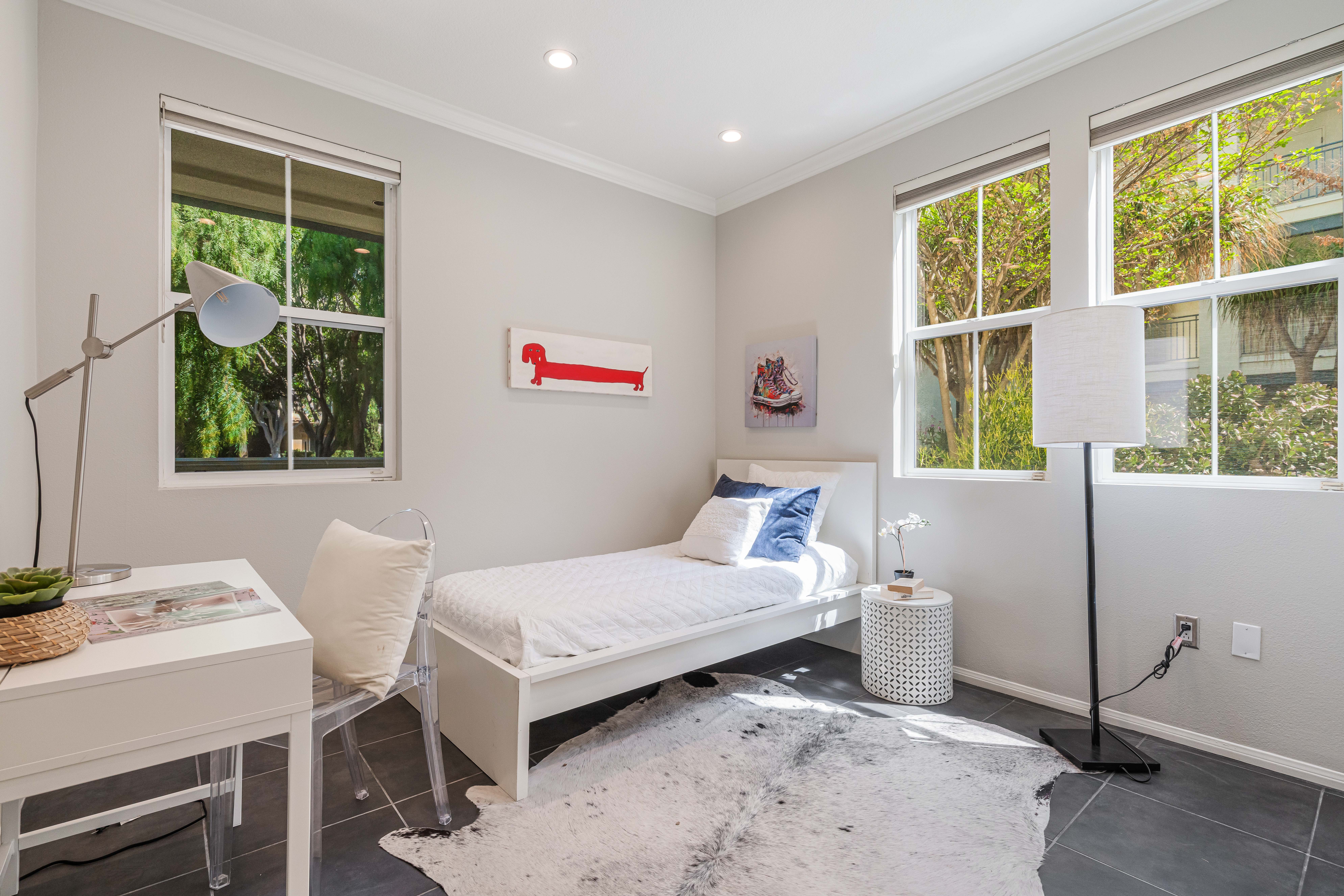 12963 West Runway Road Playa Vista, CA 90094 - Photo 17 of 39 a bedroom with a bed and a window