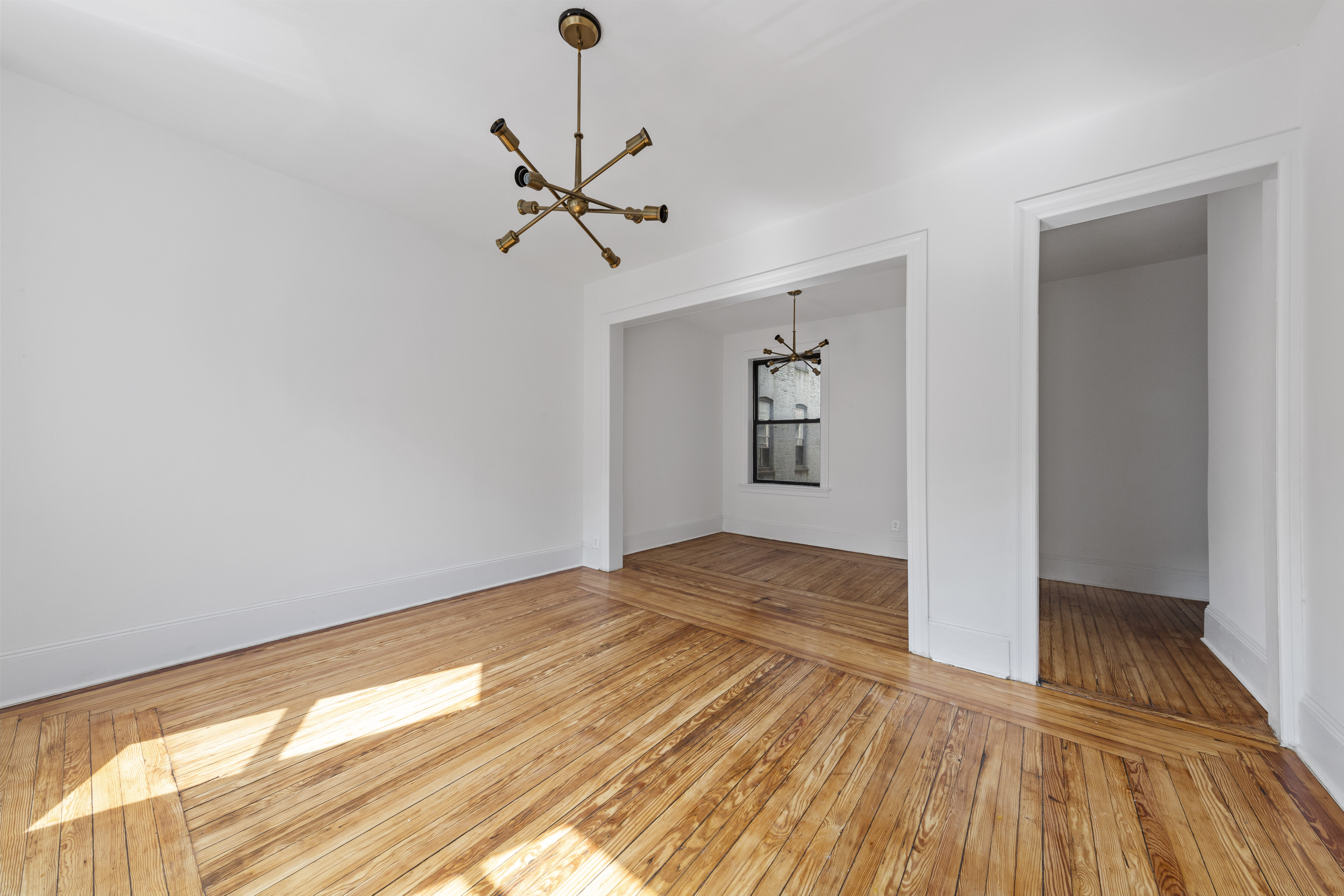 172 Prospect Park West, Unit 3L Brooklyn, NY 11215 - Photo 2 of 10 a view of empty room with wooden floor and fan
